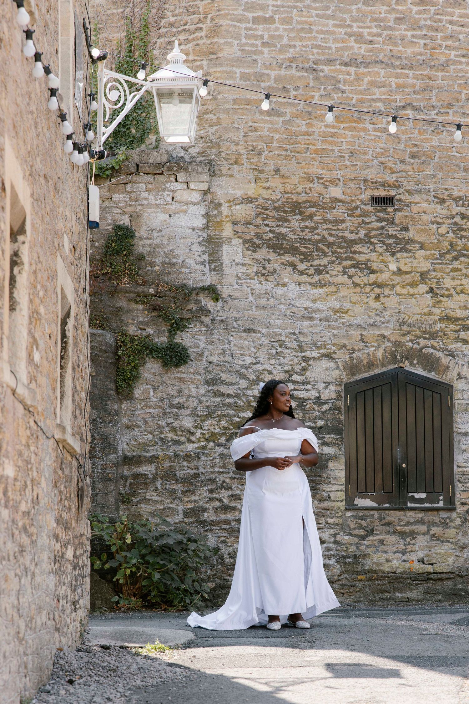 Bride nervously waiting for her dad to come and walk her down the aisle at her Silk mill studio, Frome