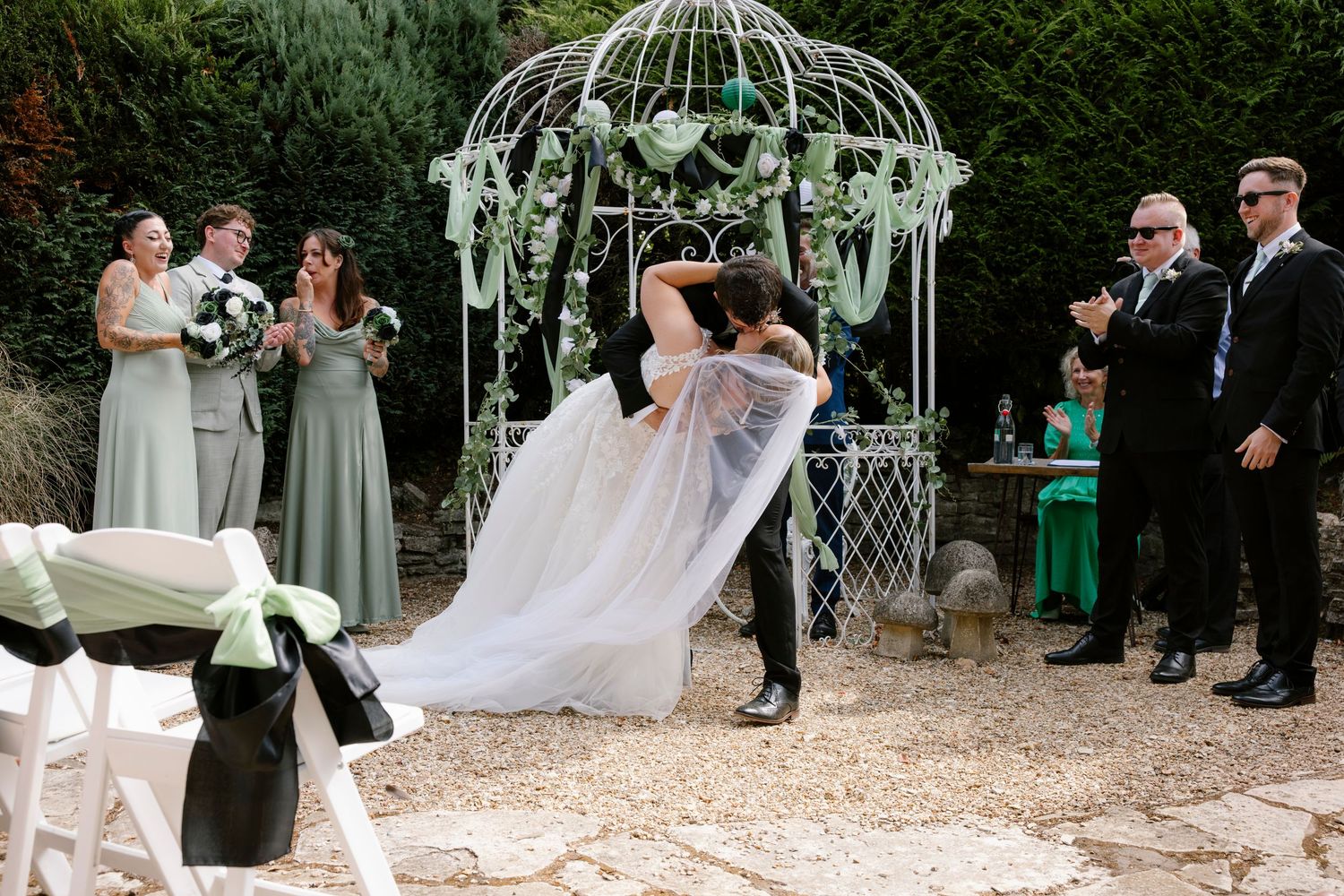 First kiss, dip kiss at at a wedding at the Orangery suite