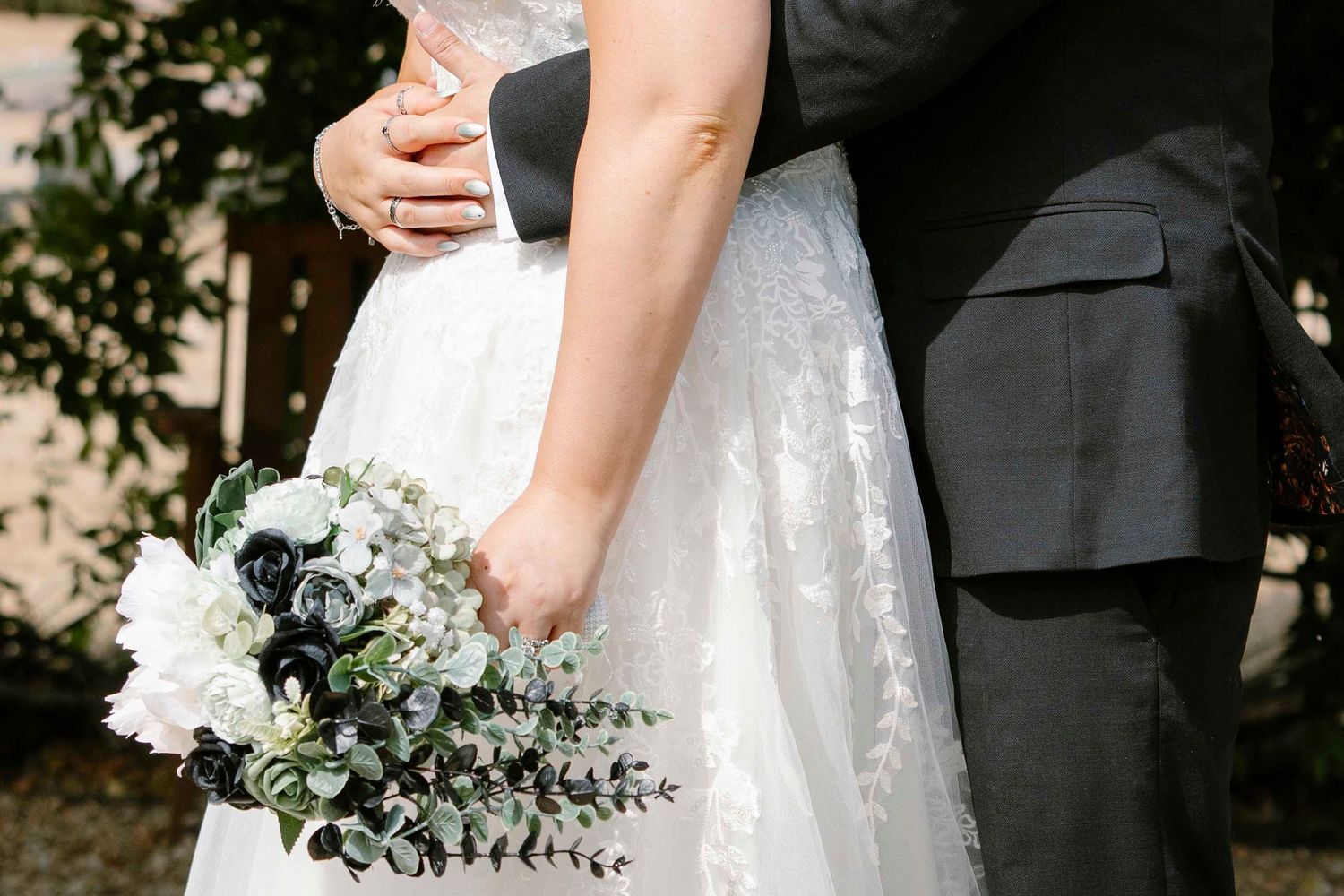 husband and wife hugging at a wedding at the Orangery suite