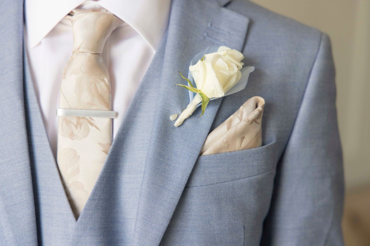 Pocket square and flower on suit