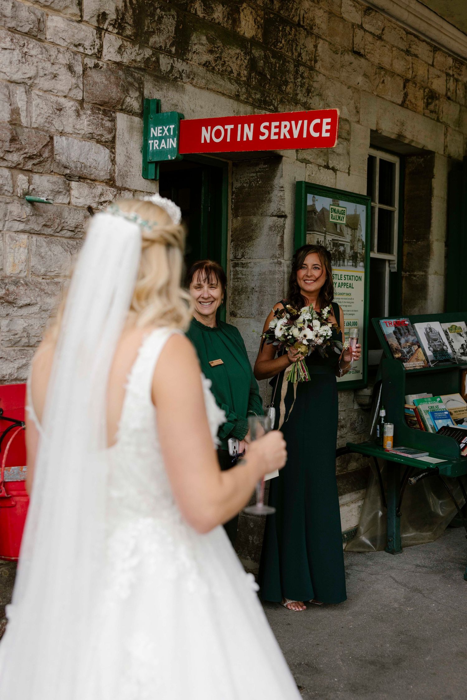 Not in Service featuring above the bride as her bridal party admires her dress before they get married