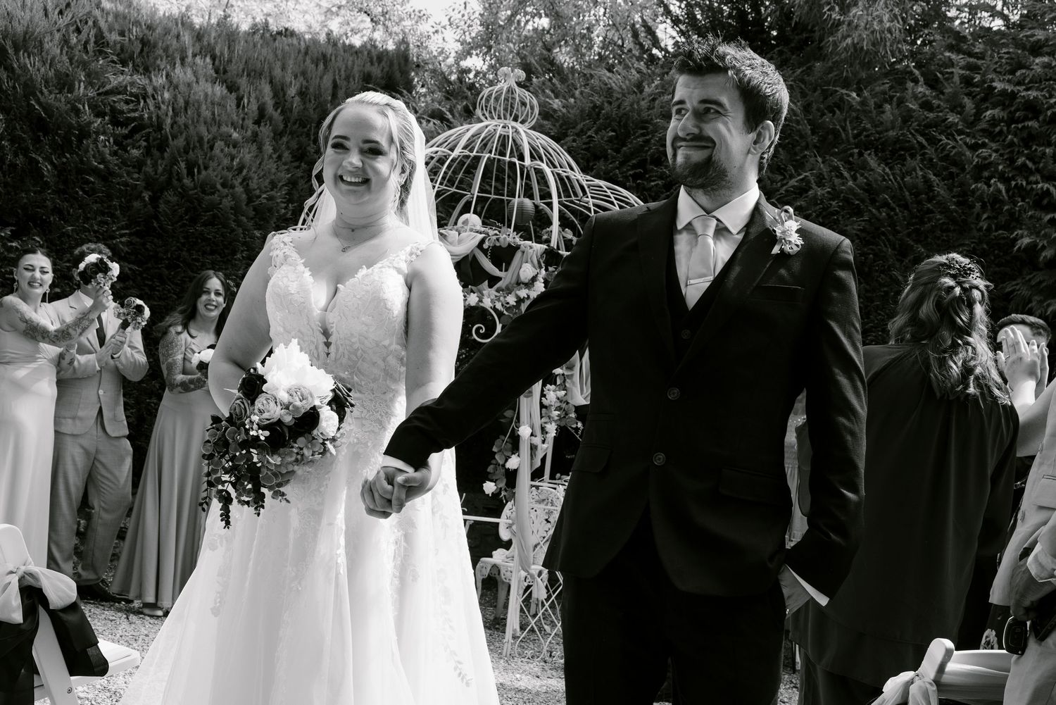 Husband and wife walking back up the alter as they have just gotten married, documentary
