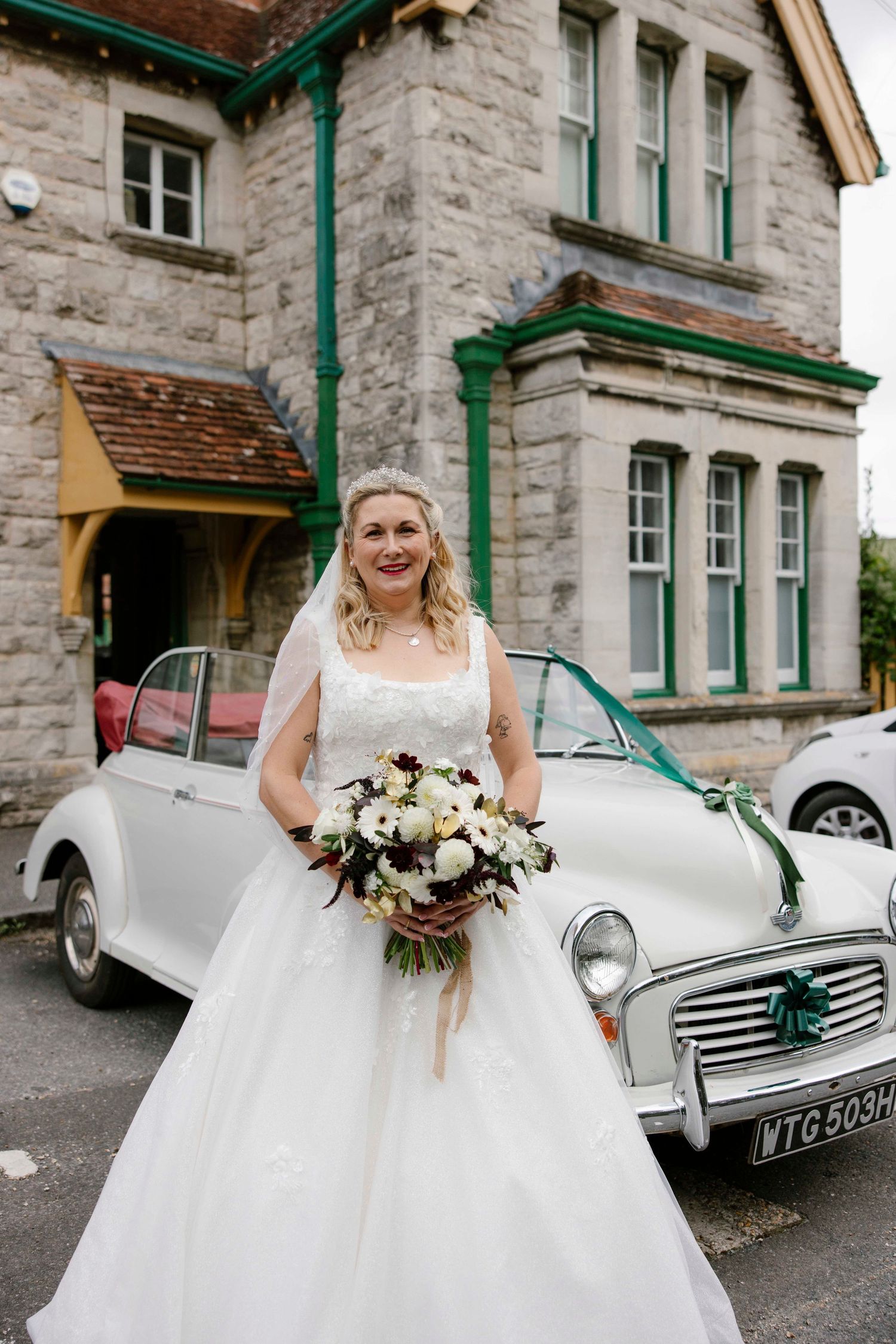 Bride arrived in Morris Minor and stands in from at the railway
