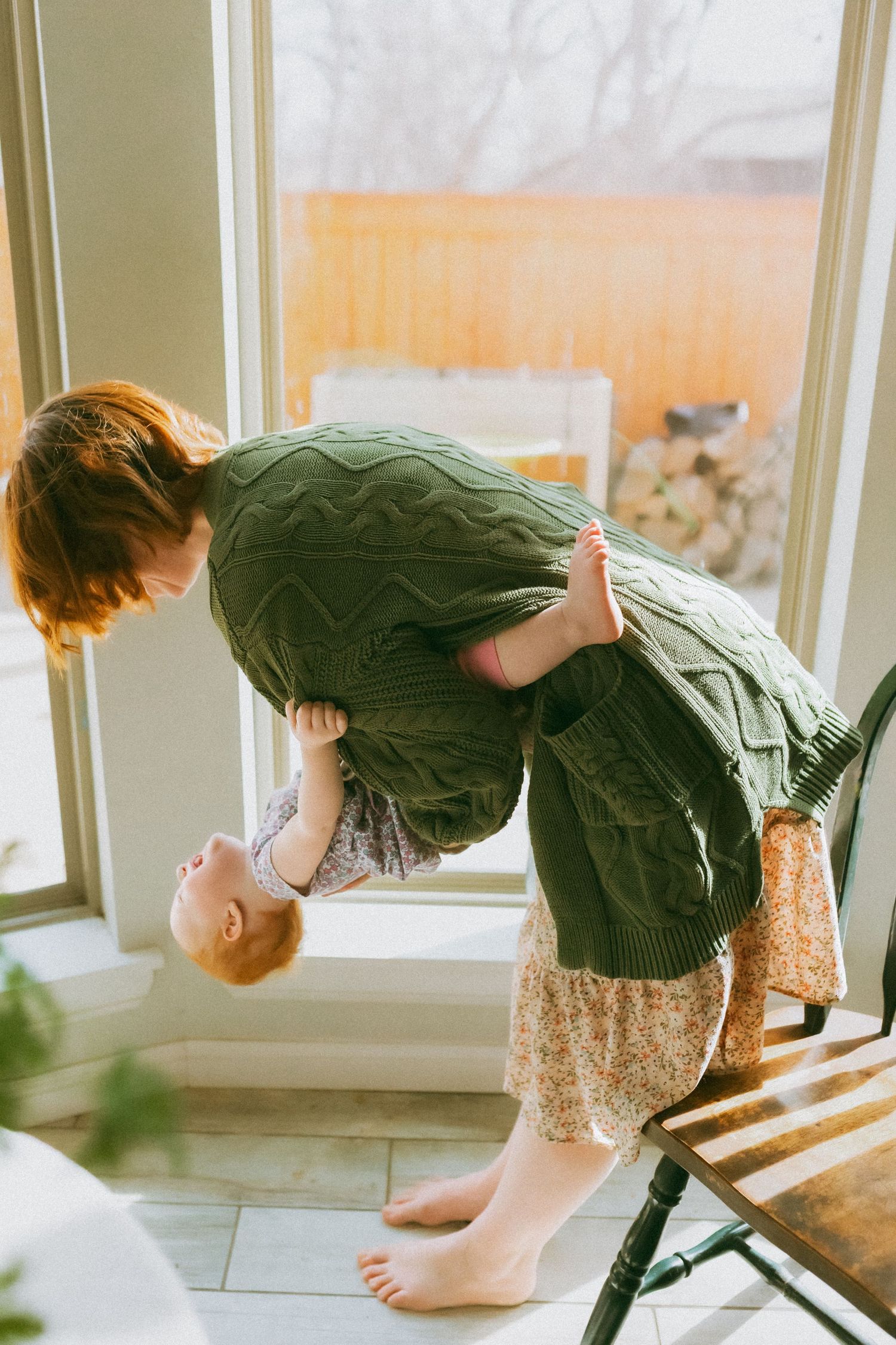 A series of photos showing a person in a green sweater sitting by a window in soft natural light.