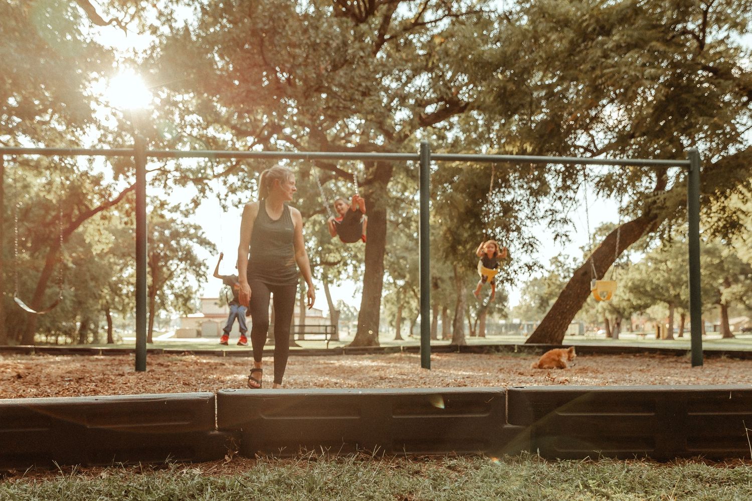Fort Sill, Oklahoma Documentary family photographer Liz Perez in the frame with her kids at the park by using the interval timer on the DSLR