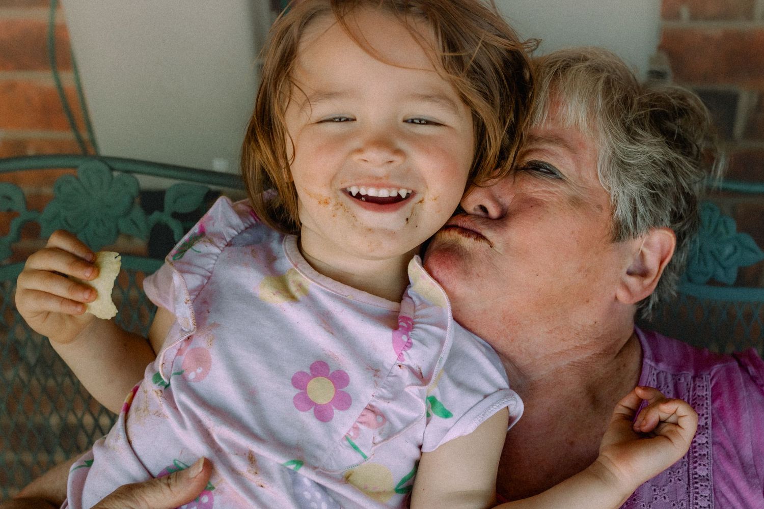 A series of playful kisses and laughter shared in a joyful sequence of moments.