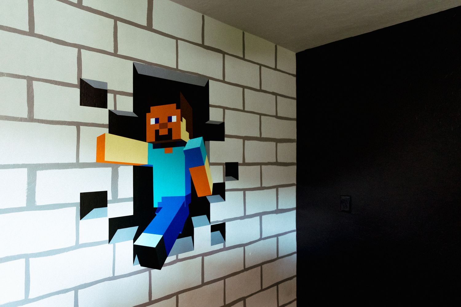 A pixelated Minecraft Steve character appears to be jumping out of a white brick wall in a creative 3D illusion artwork.