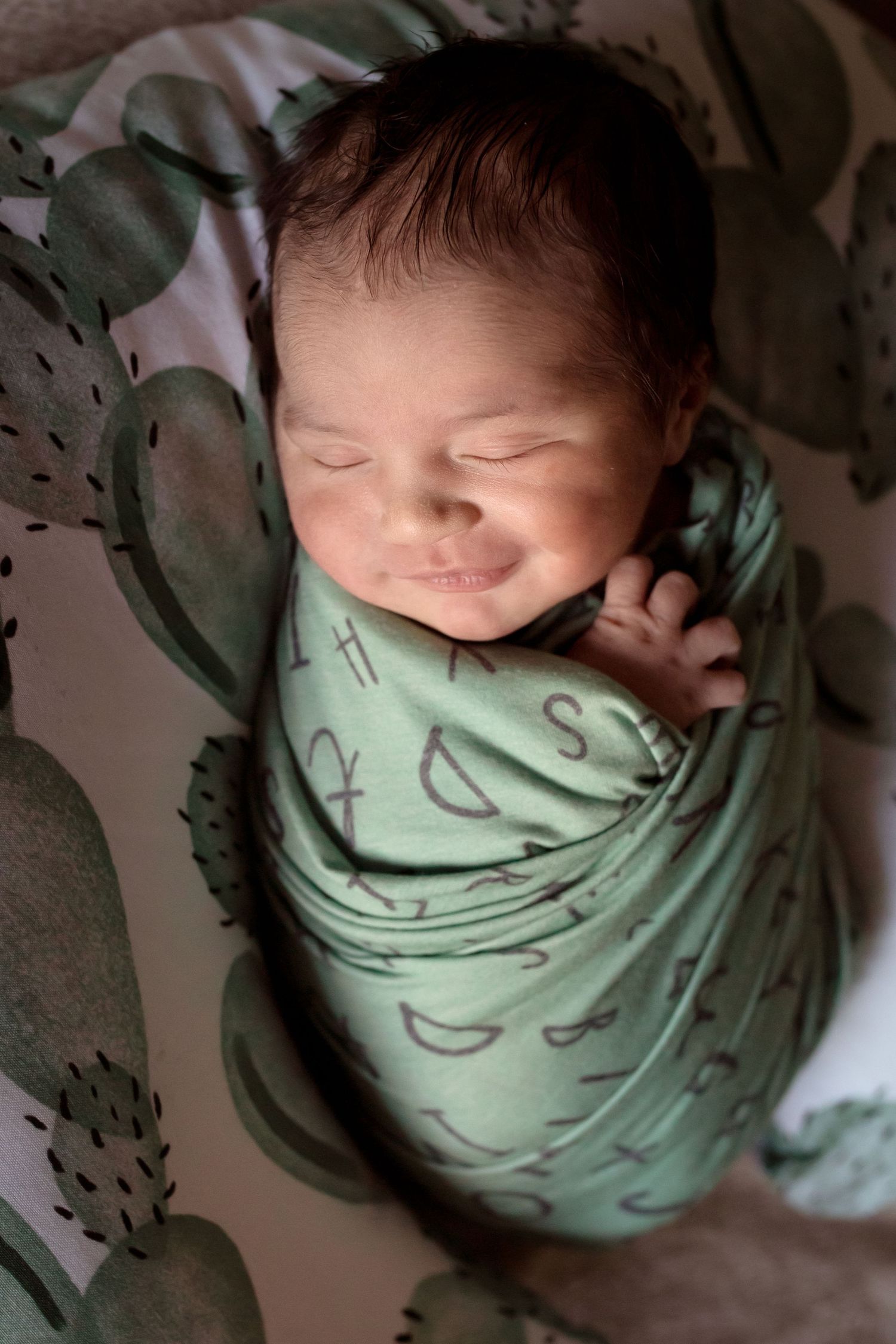 A sleeping baby wrapped in a mint green swaddle blanket is shown from different angles in a series of photos.