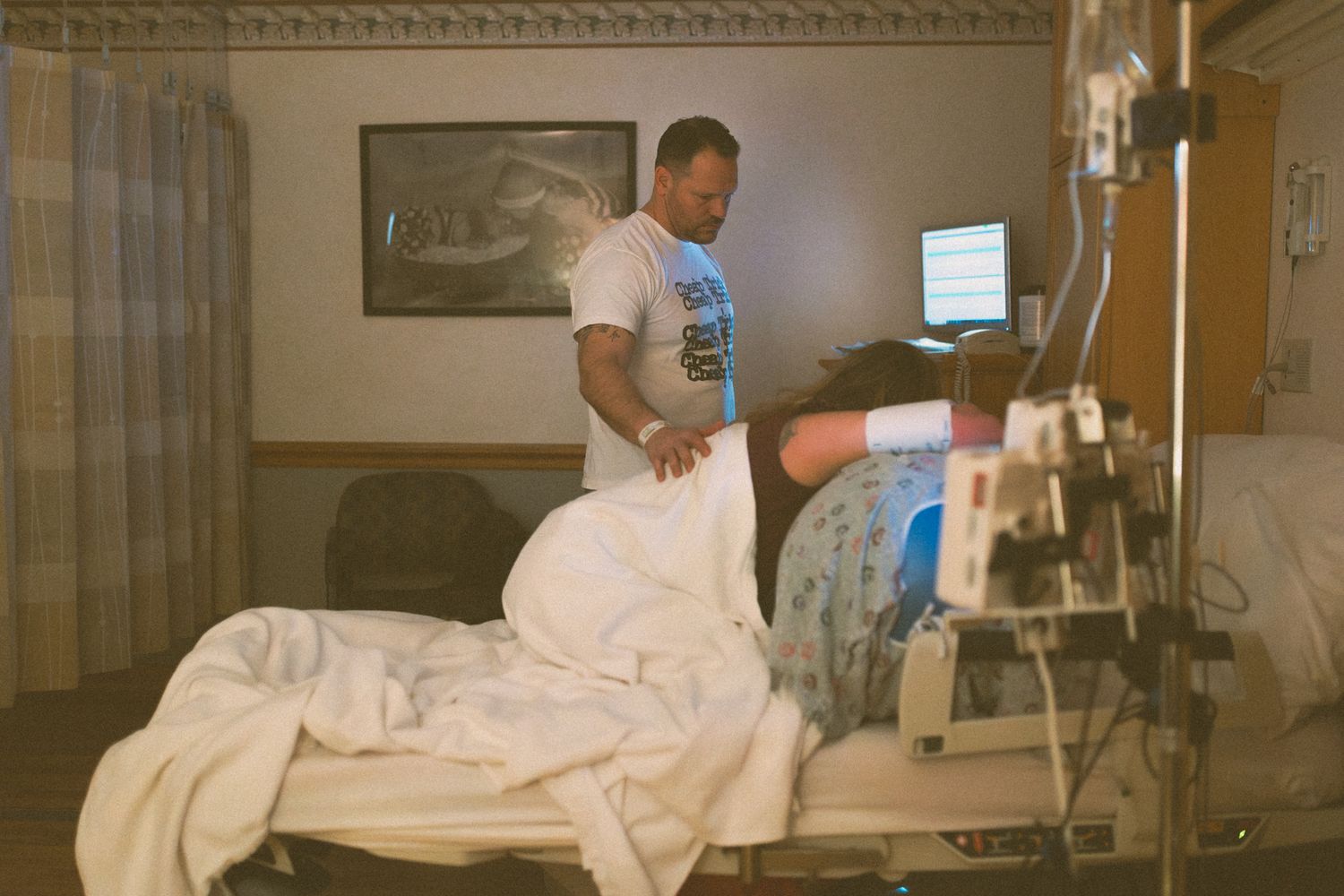 Husband is helping his wife labor during her birthing soon to welcome home a new baby in Fort Sill, Oklahoma.