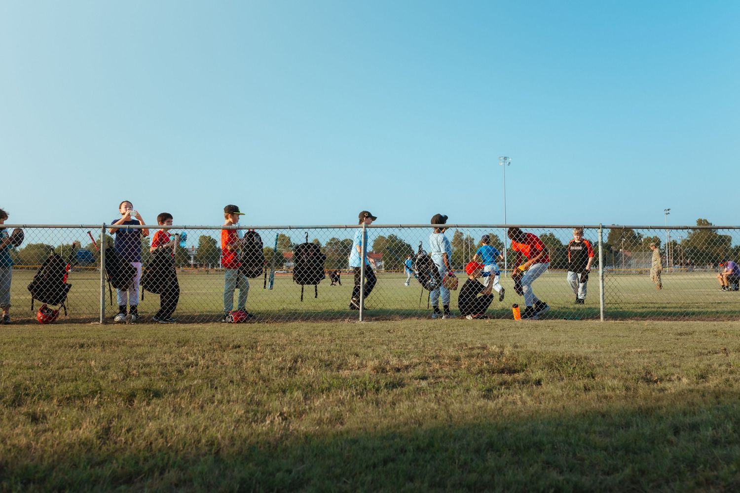 A panoramic series of people and horses gathered in an open field during a riding or training event. Fort Sill, Photography Liz Perez