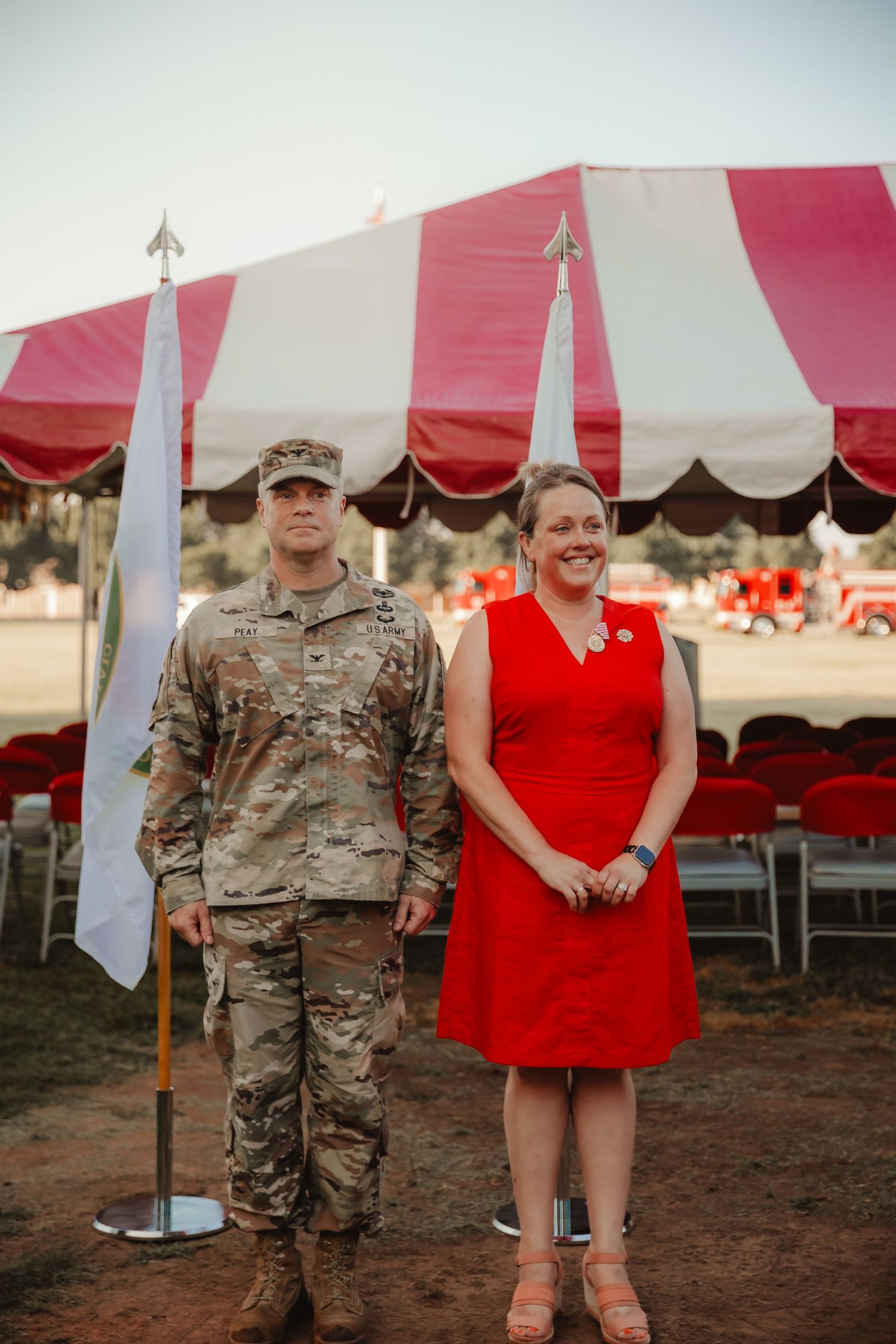 A series of photos showing military personnel in camouflage uniforms alongside someone in a red dress at an outdoor event.