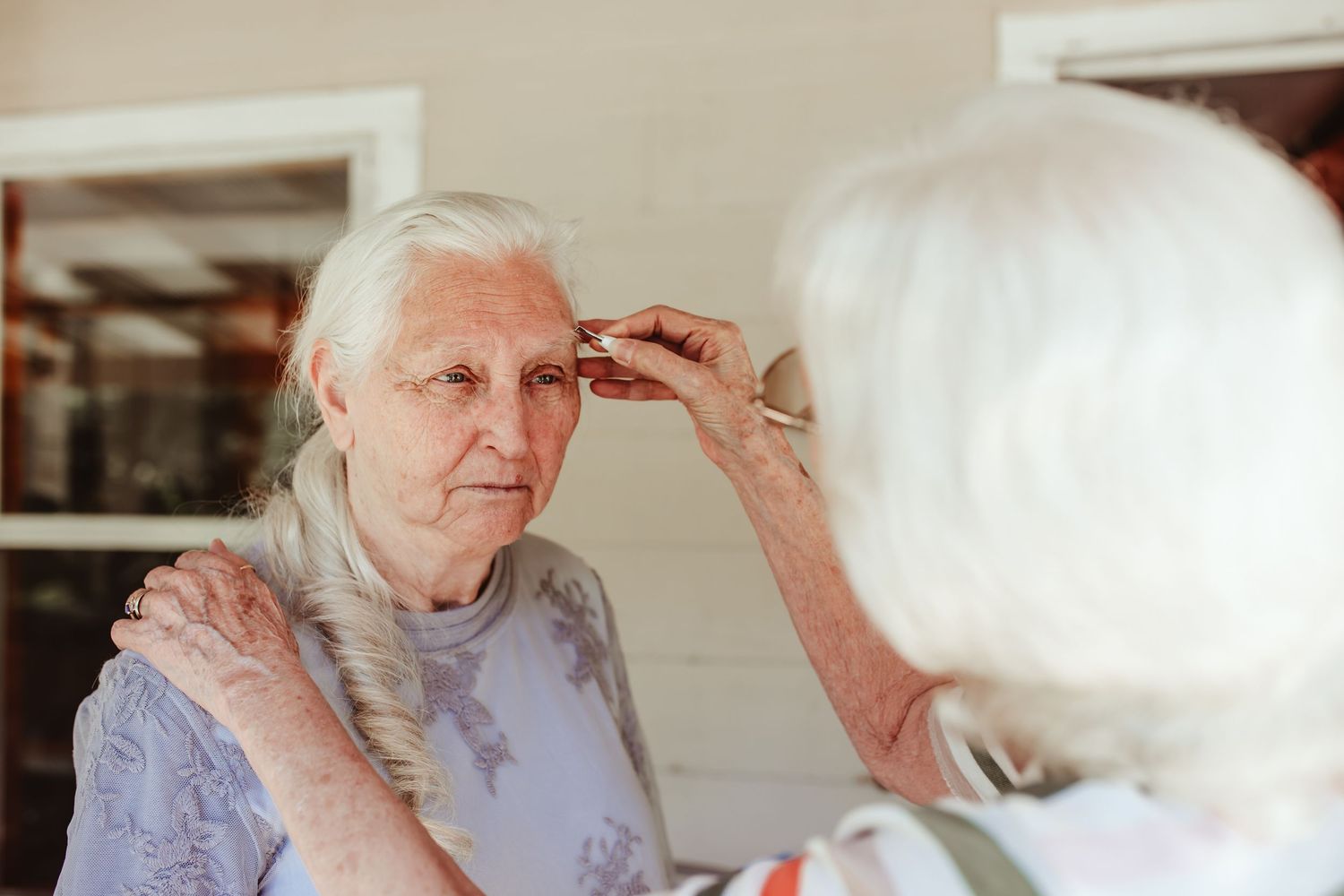 Medical or care-related procedure being performed in a clinical setting.