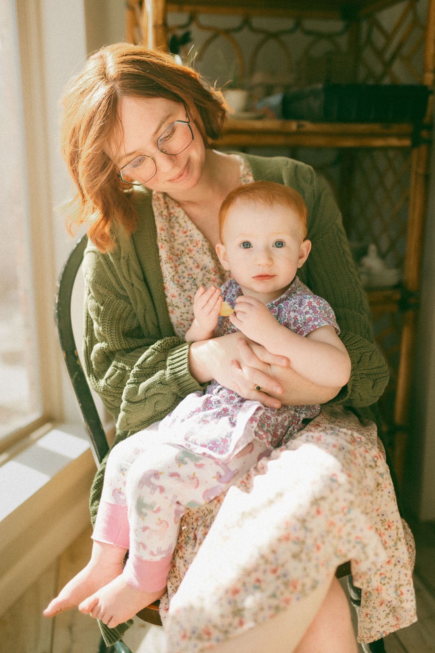 A series of warm-toned photos showing tender moments between a parent and young child in a sunlit room.