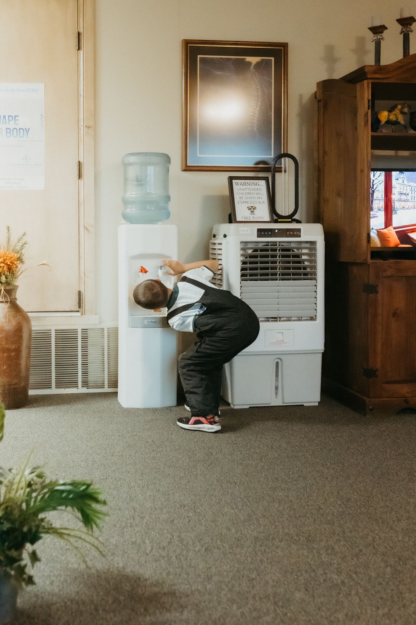 Series showing someone interacting with a water dispenser in an office space.