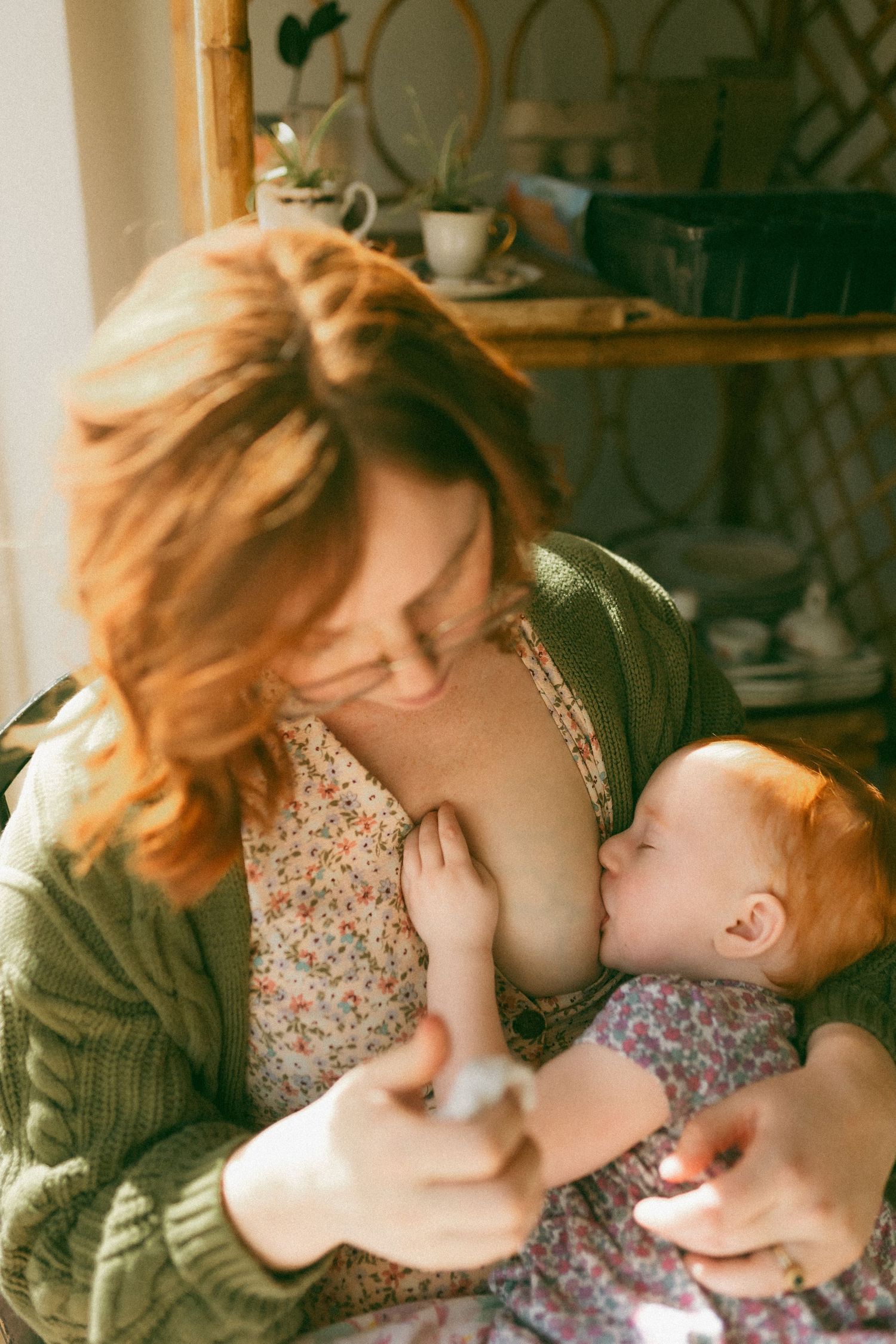 A tender moment between parent and child in warm natural lighting shows nurturing care and connection.