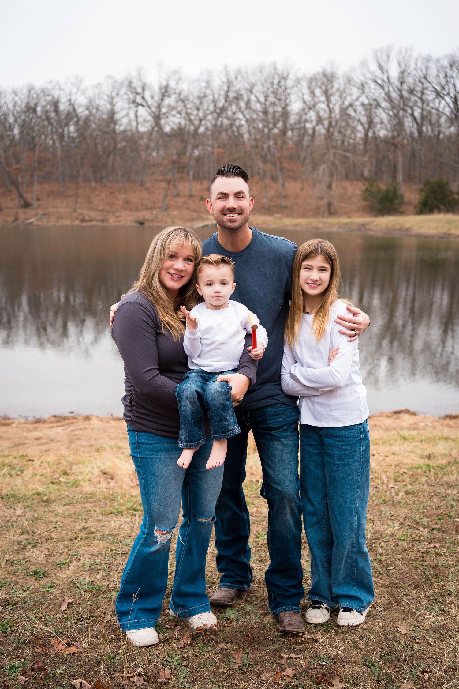 Family photos at a lake in Knob Noster state park with a Warrensburg family photographer