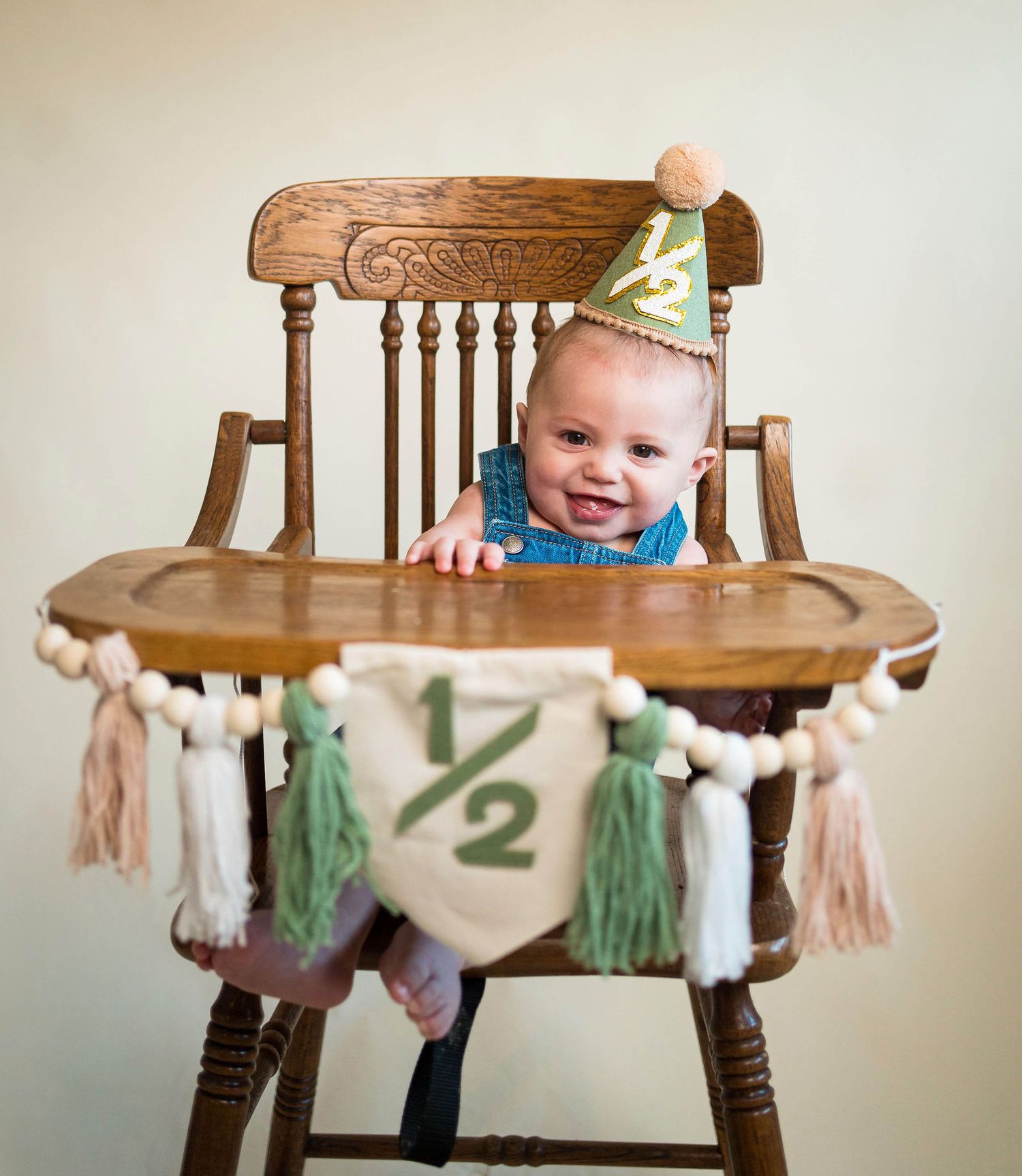 A baby giggles during his milestone session in Warrensburg, MO
