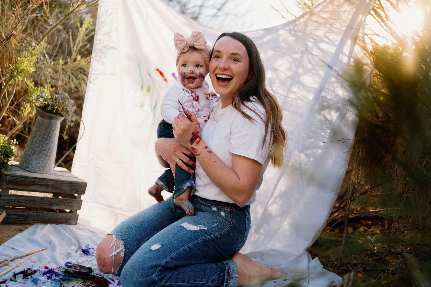 A mom snuggles her baby close during the motherhood milestone photos in Warrensburg, MO