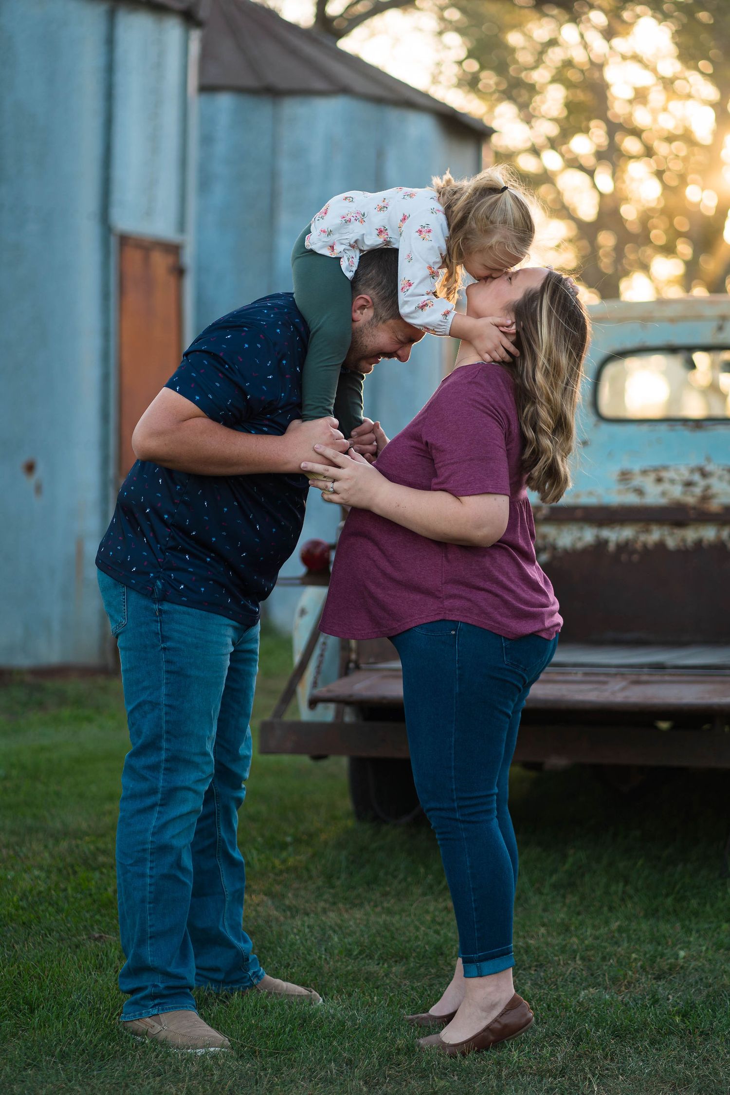 mom kisses baby during maternity session in warrensburg