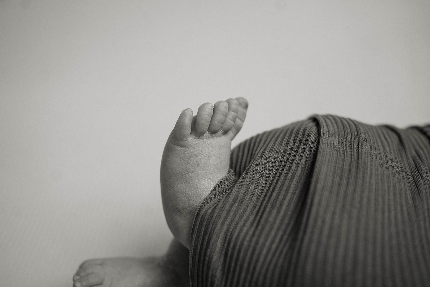 Close up of baby's foot during their newborn photography session located in Lee's Summit, MO