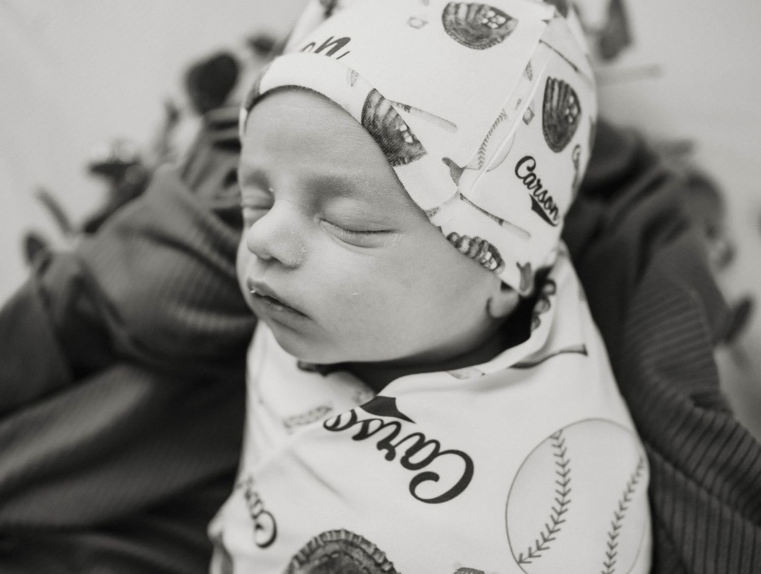 A baby sleeps peacefully during his newborn session in Warrensburg