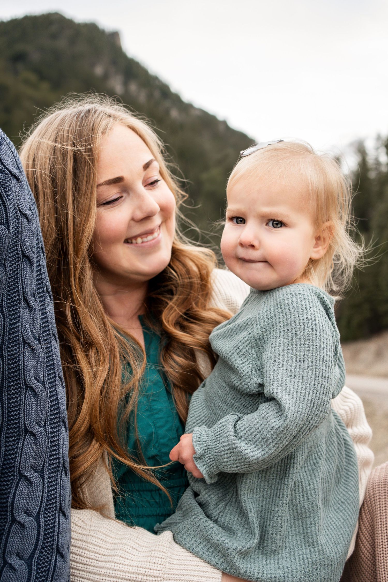 A heartwarming series of candid moments showing affection and laughter against a mountain backdrop.