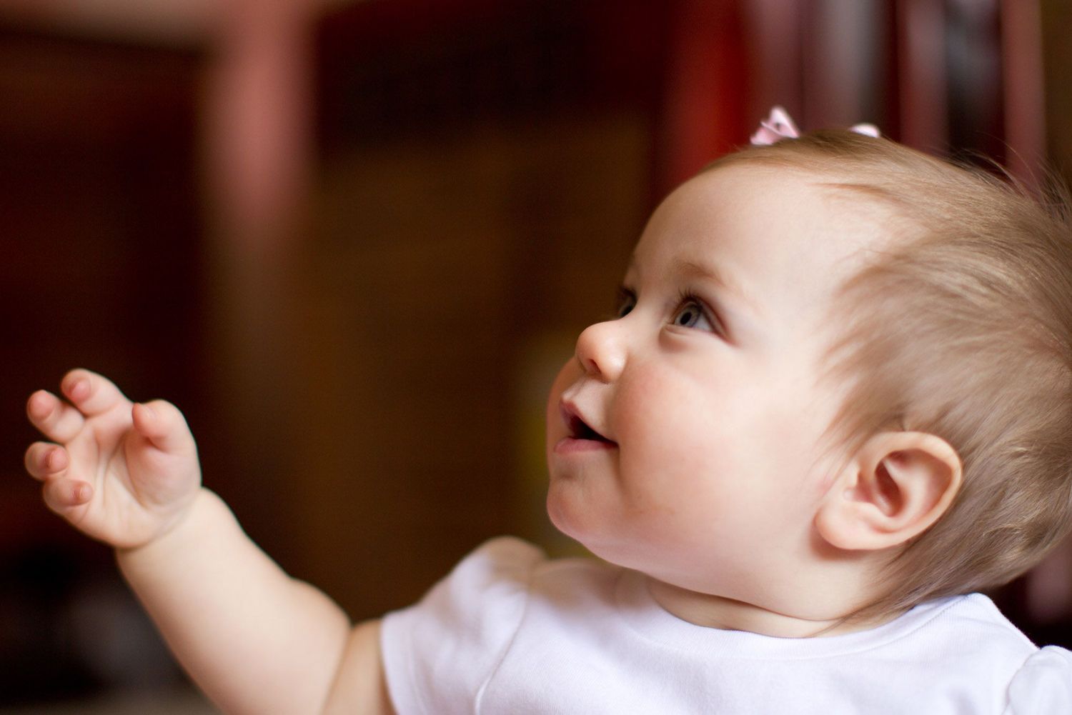 Close-up portrait series showing baby's expressions and movements.