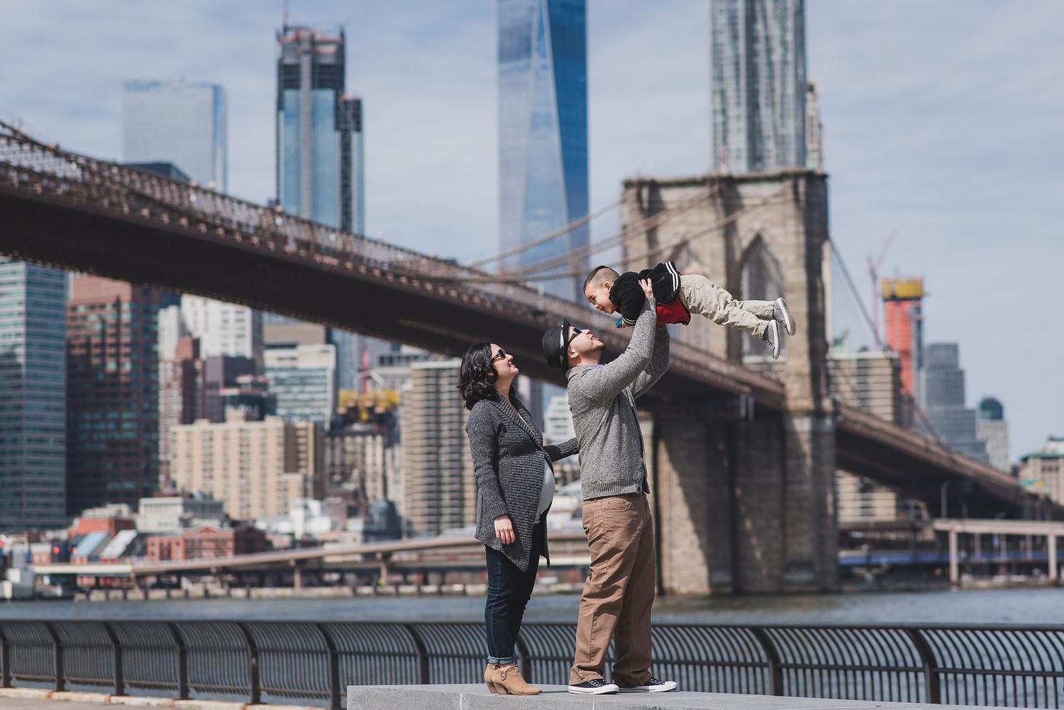 Urban engagement photos with Brooklyn Bridge and Manhattan skyline in background.