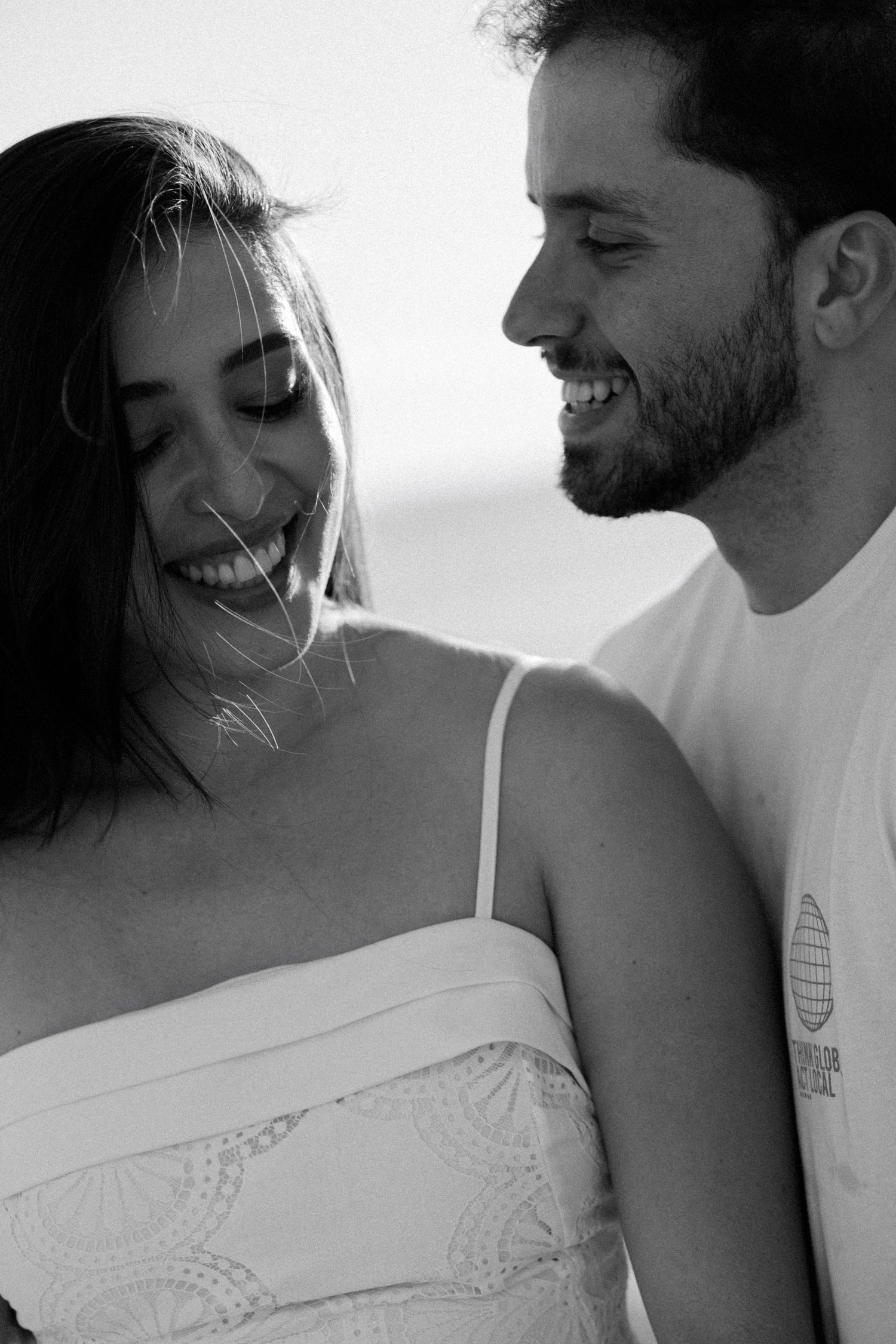 Intimate black and white close-up portraits showing tender moments between couple.
