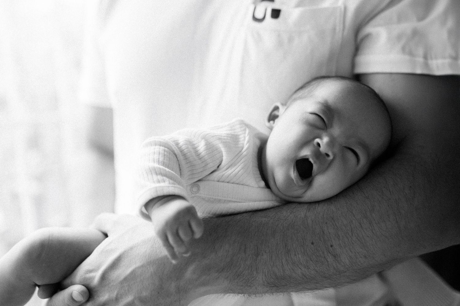 Black and white portrait series of peaceful sleeping baby.