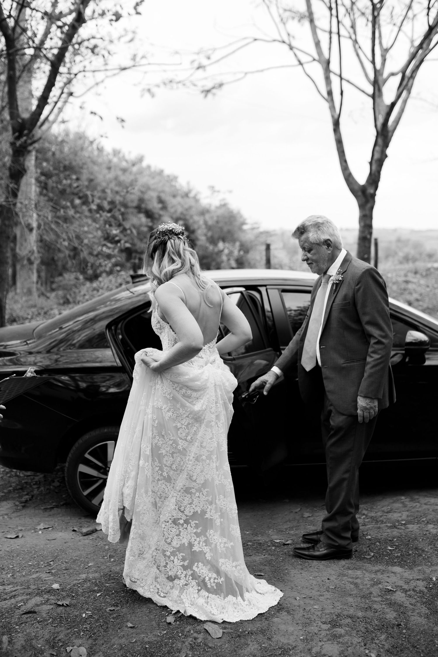Black and white photo sequence showing a bride in a lace dress getting out of a vintage car.