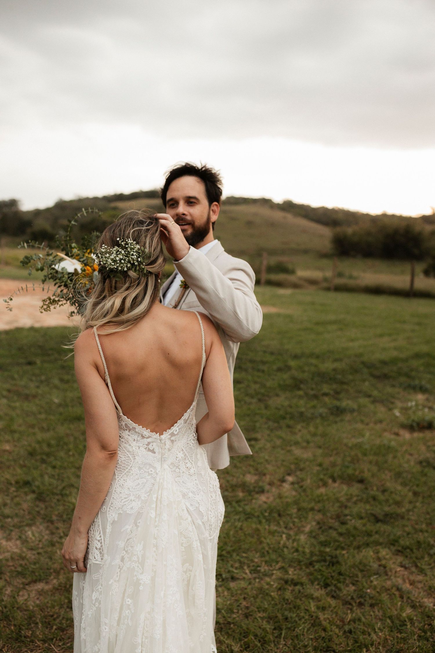 Wedding couple shares emotional first look moment in natural outdoor setting.