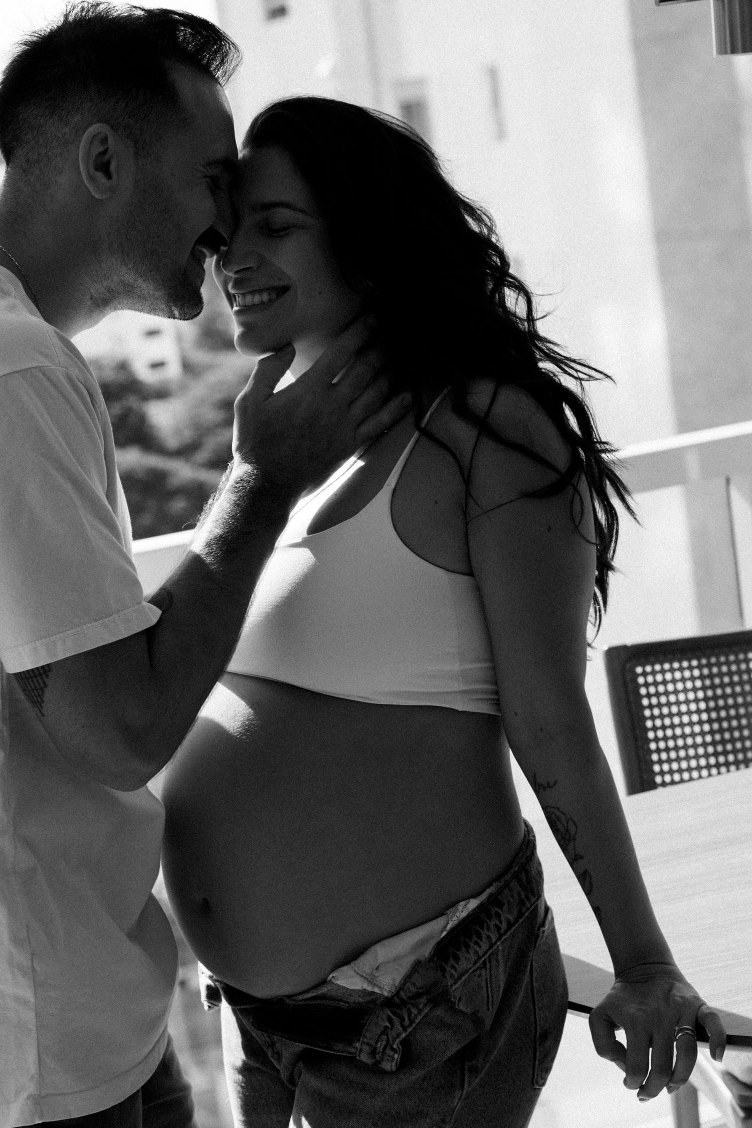 Black and white romantic couple photography session on a porch.