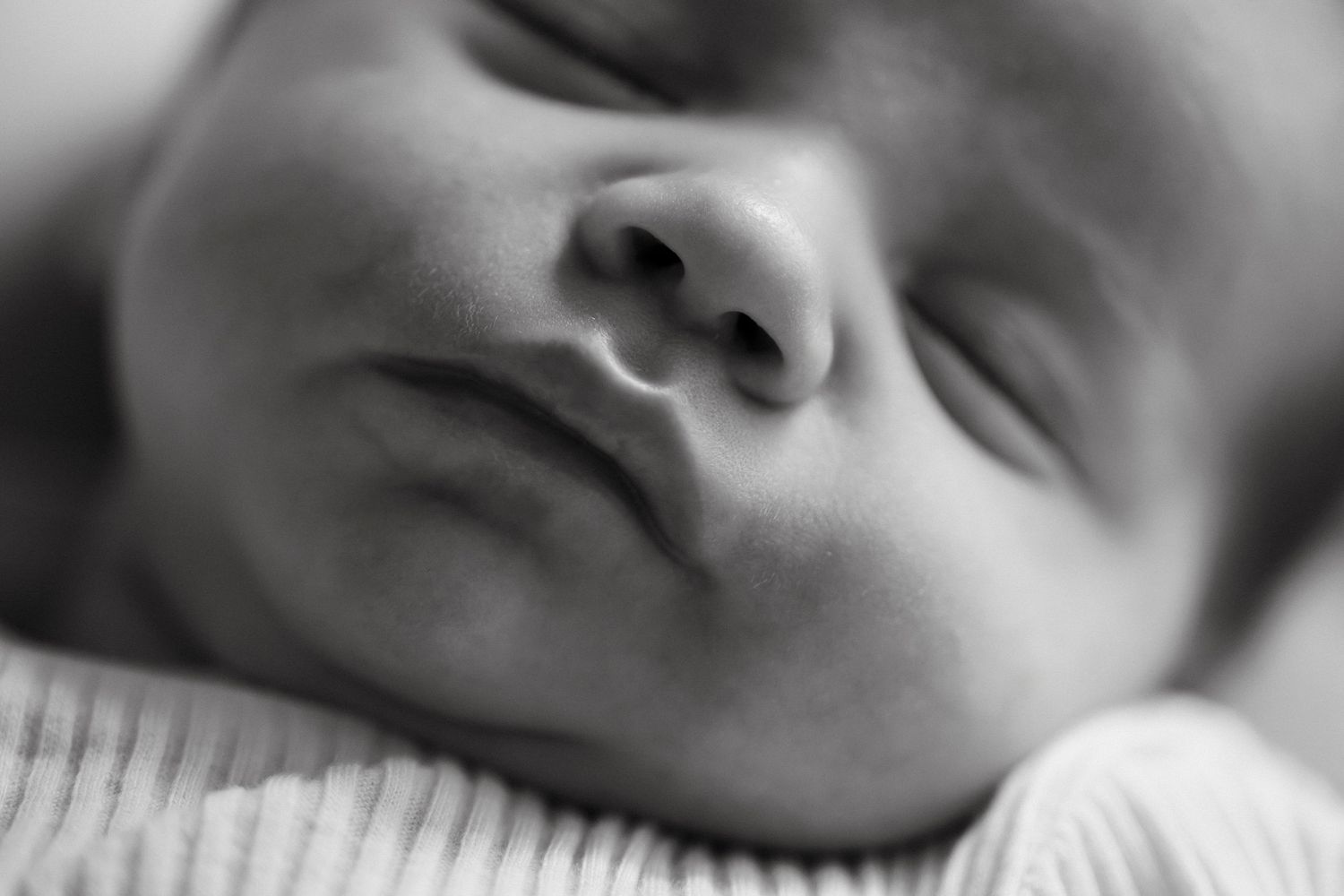 Close-up black and white portraits showing peaceful expressions.
