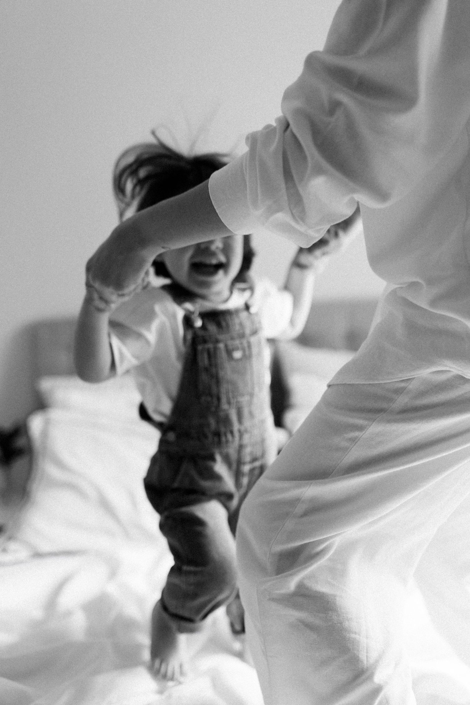 Black and white sequence showing movement and play against a white background.
