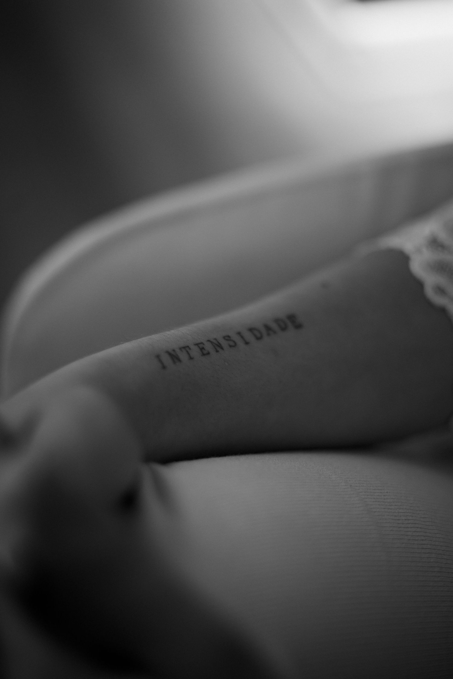 Close-up black and white macro shot of text on paper with shallow depth of field.
