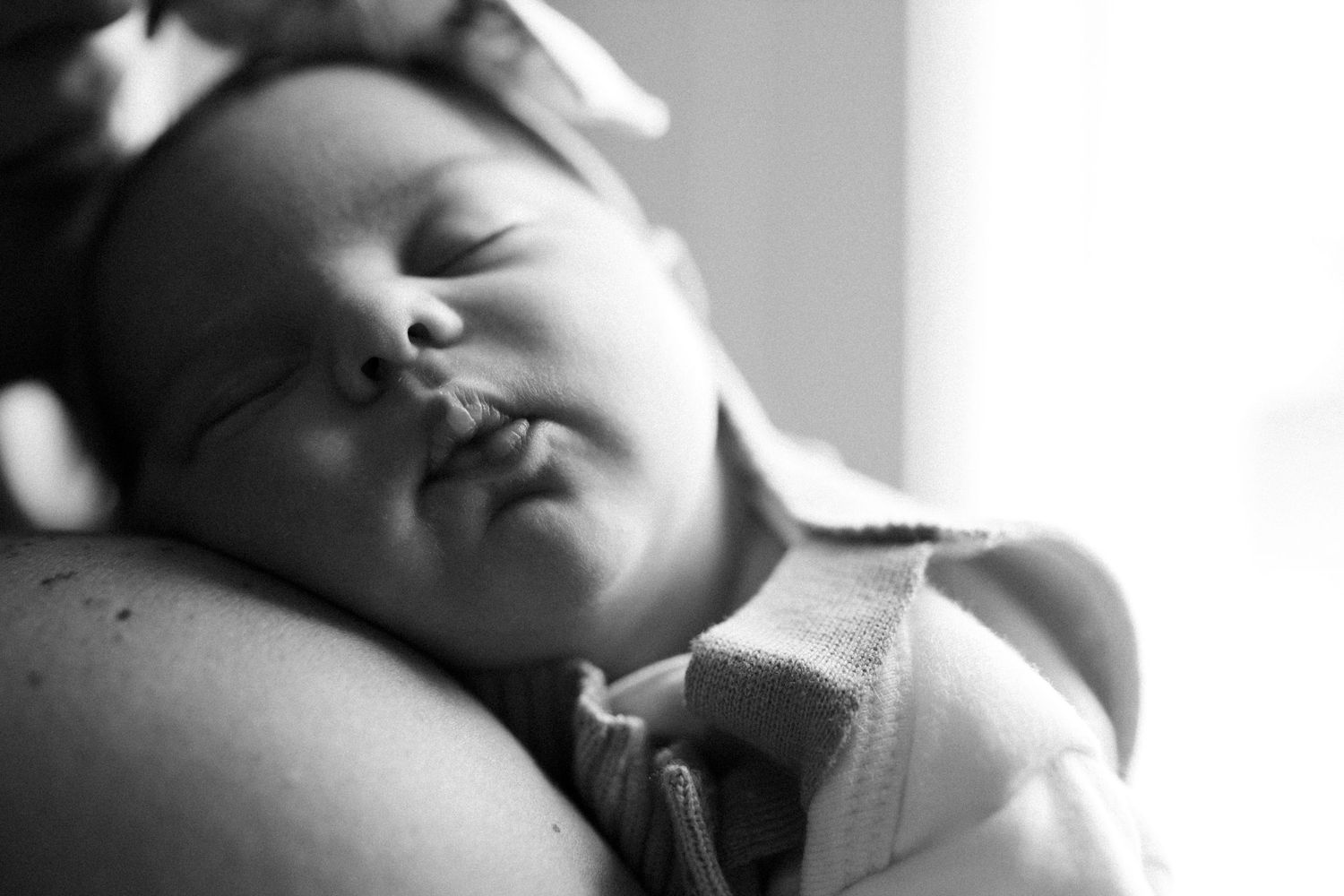 Intimate black and white close-up photo showing tender moments of rest and connection.
