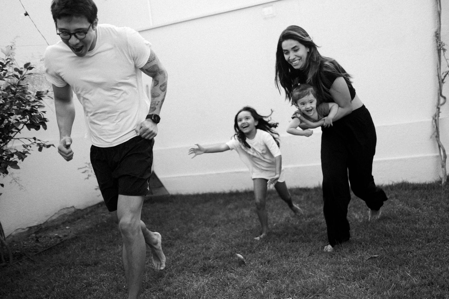 Dynamic sequence of movement and play against a white wall outdoors.