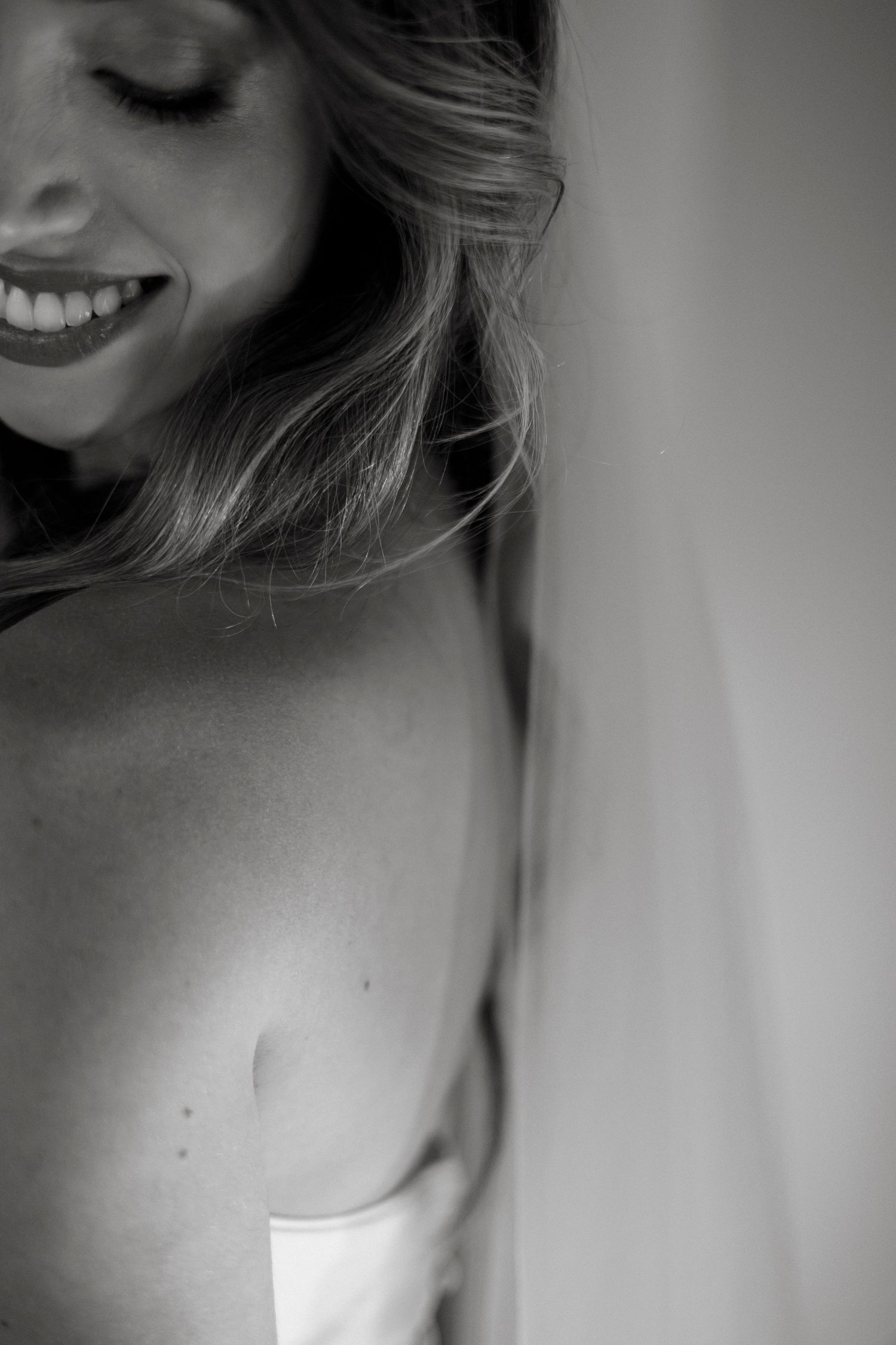 Artistic black and white portrait series with soft natural lighting.