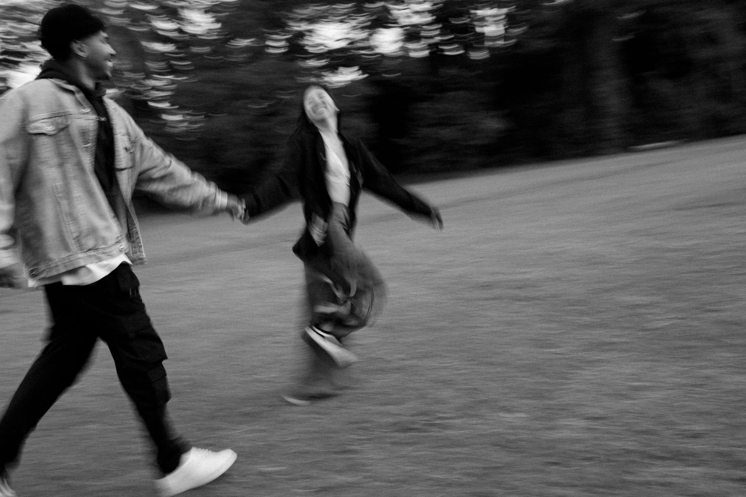 Motion blur of people walking and running in black and white photography.