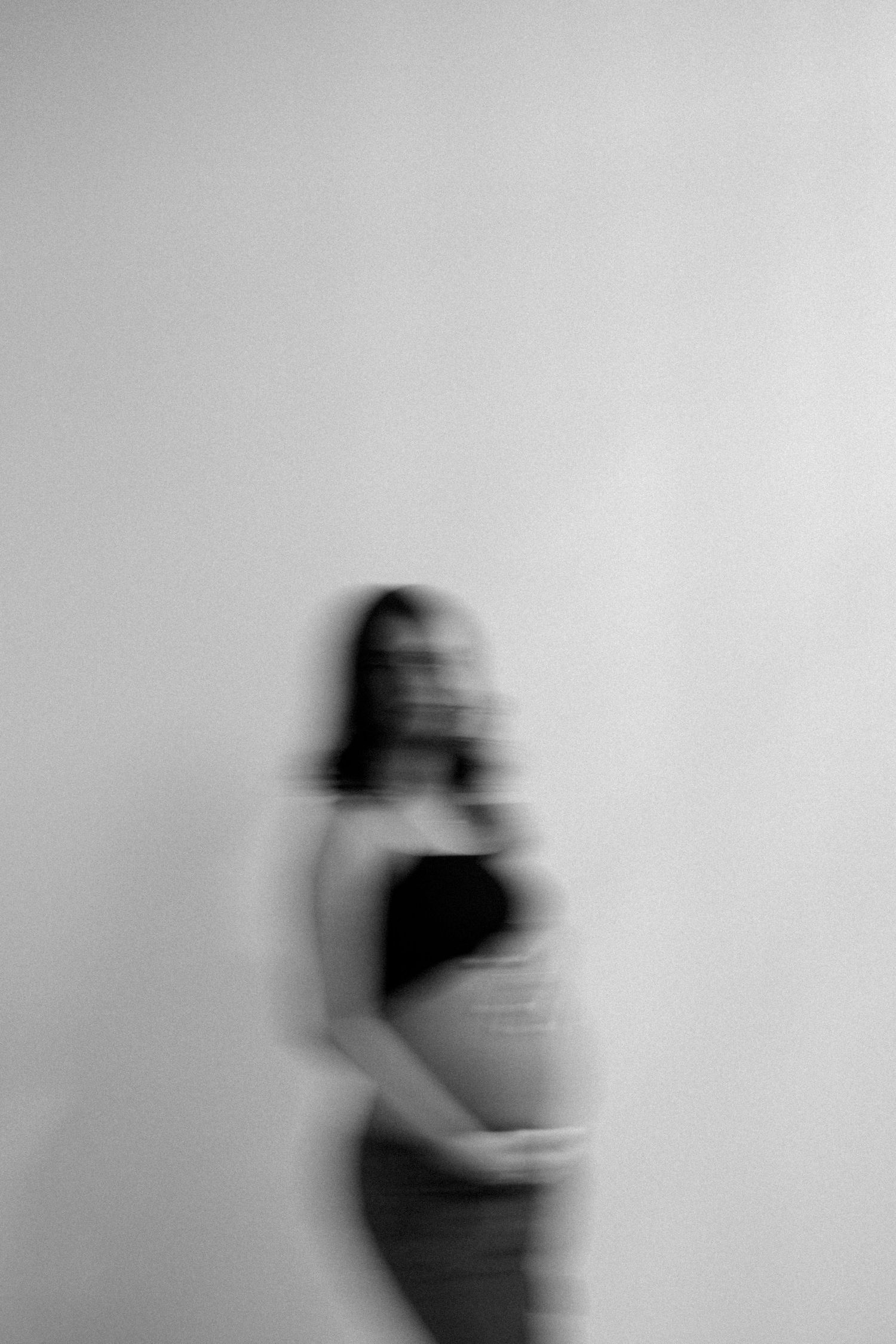 Minimalist series showing blurred silhouettes moving against a light background.