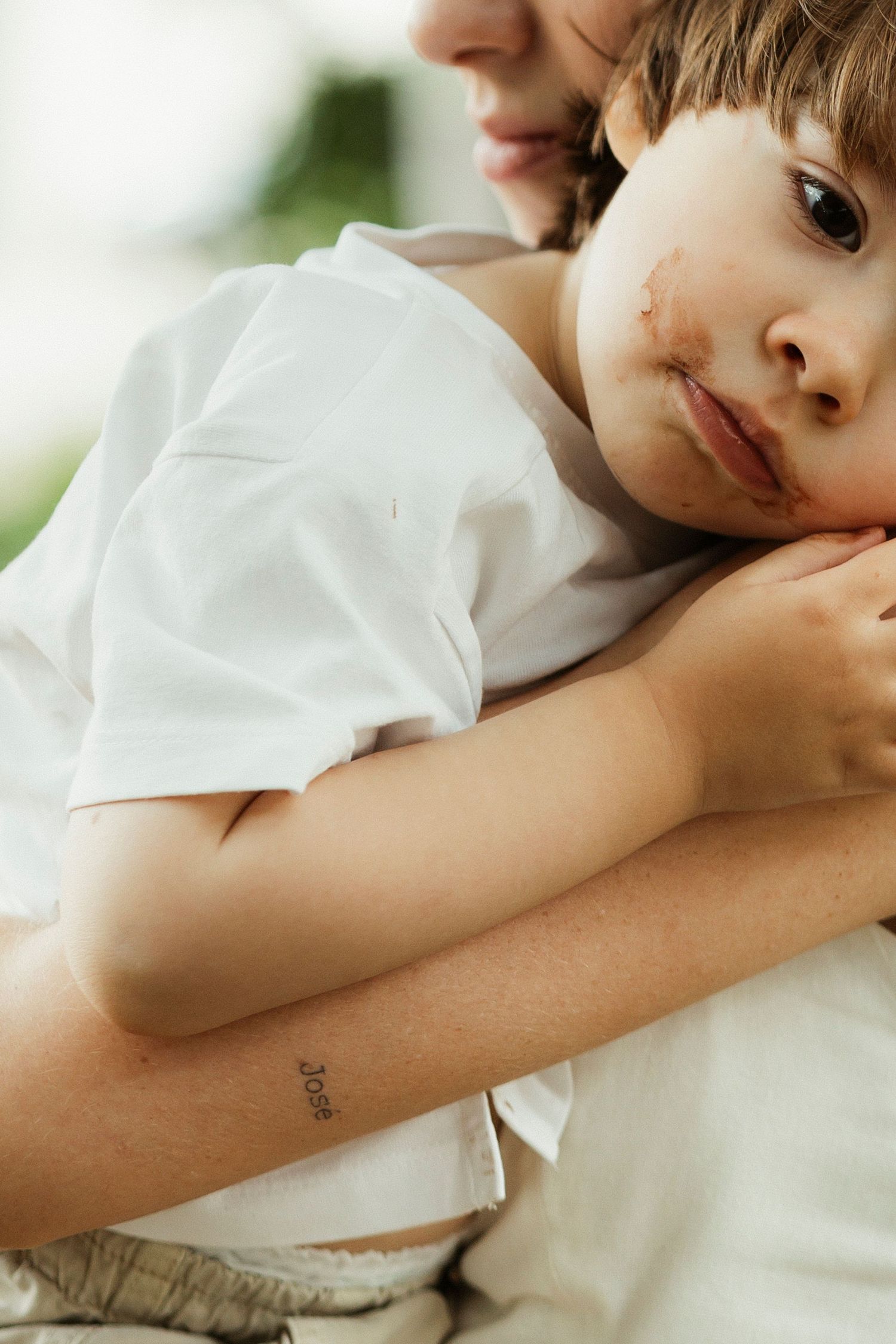 Child resting head on arm in a series of gentle poses against white background.