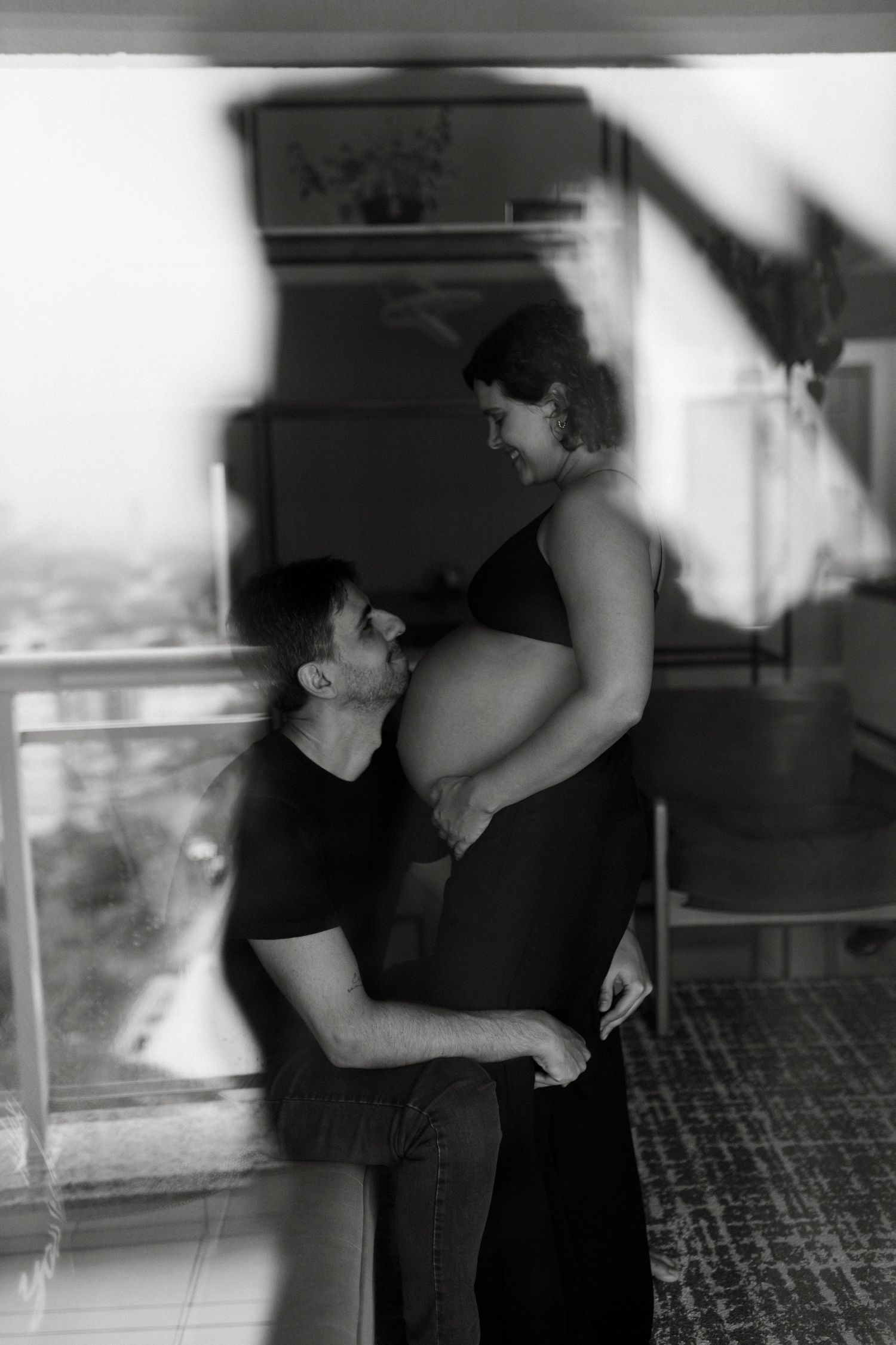 Black and white intimate couple photography session indoors.