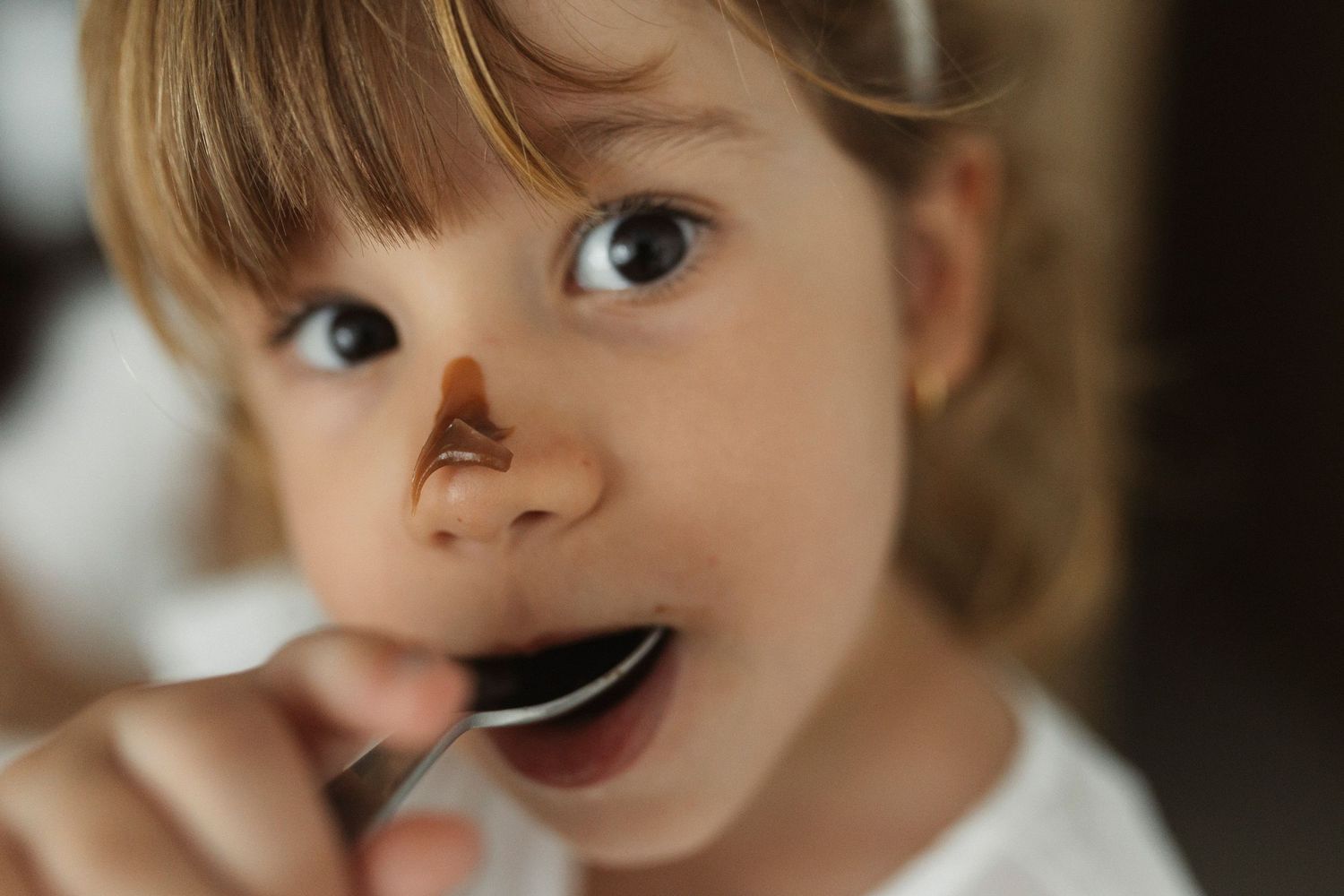 Close-up shots showing expressive eyes and playful eating moments.