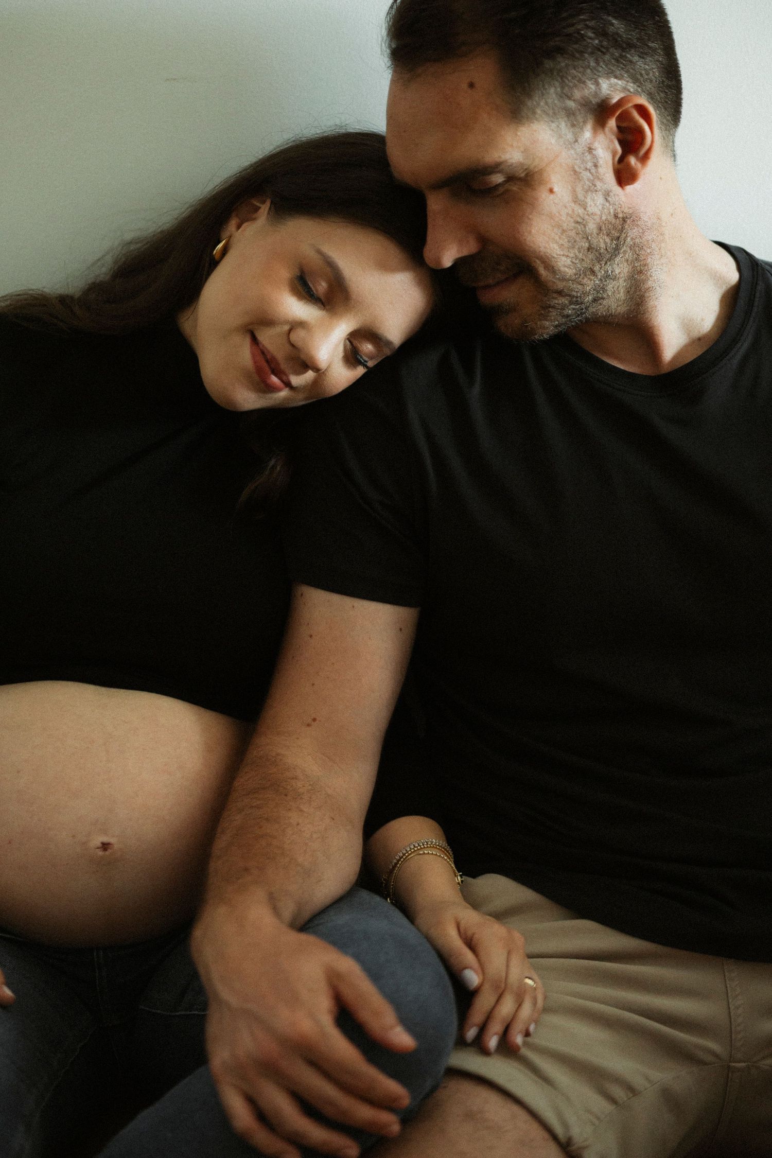 Intimate couple photos showing tender moments in black and white.