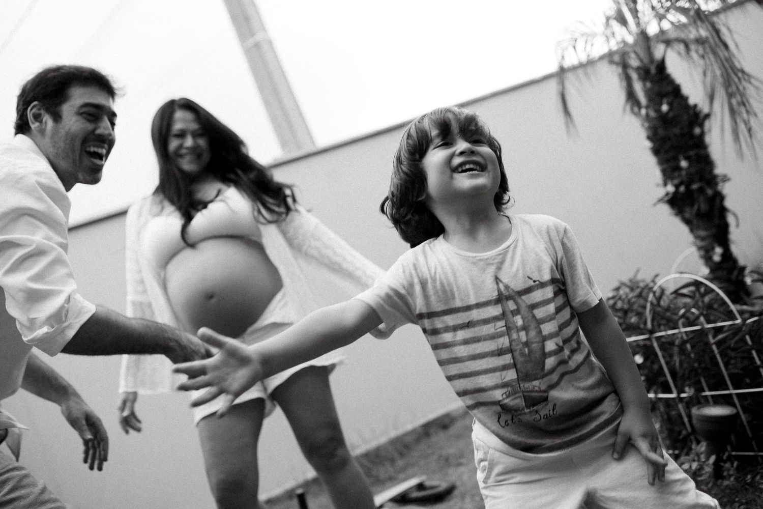 Candid black and white photos of joyful moments and laughter.