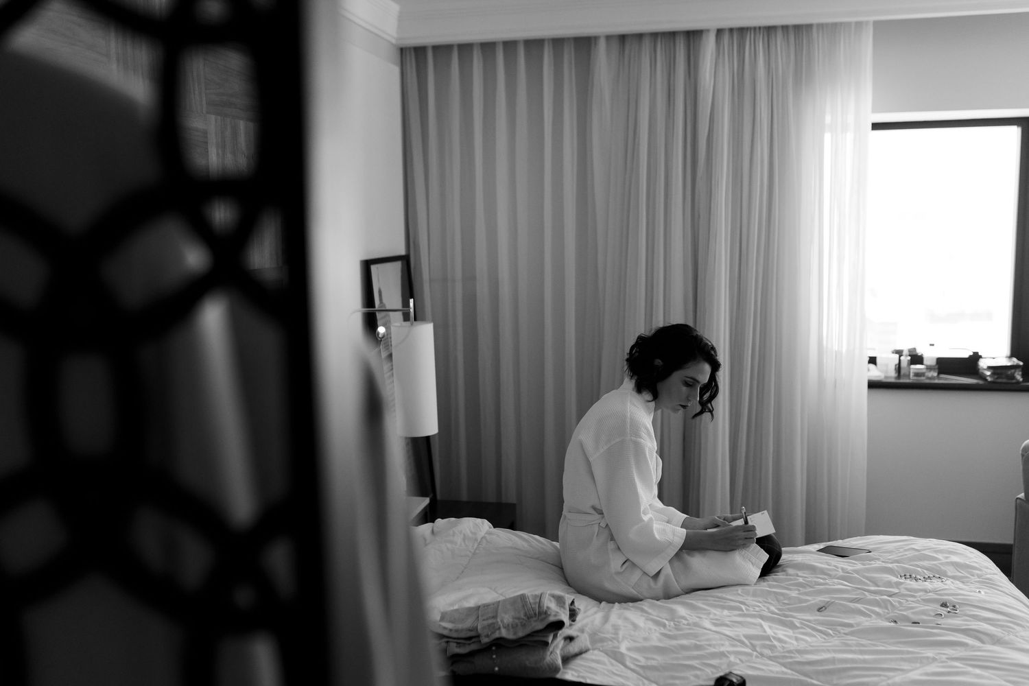 Minimalist black and white sequence showing interior hotel room preparations.