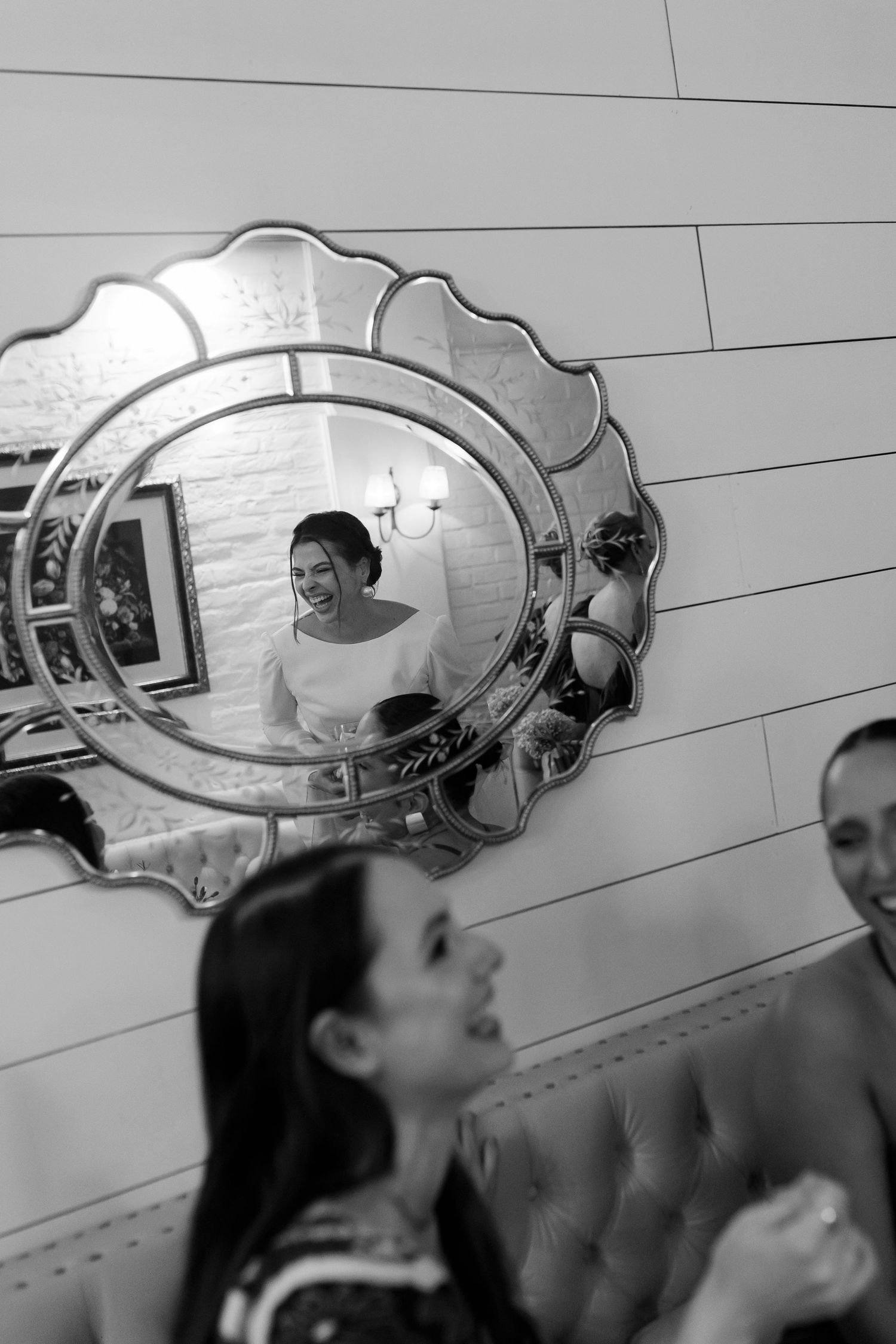 Artistic mirror reflection shots of wedding preparations in an elegant dressing room.