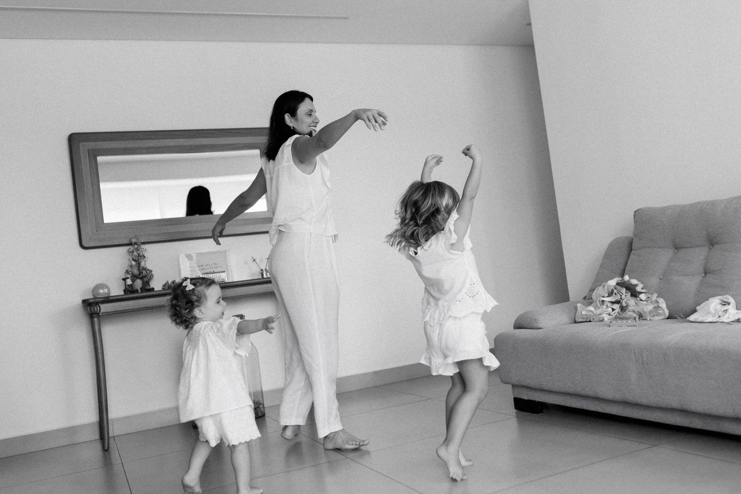 Dynamic movement sequence captured in a minimalist interior space.