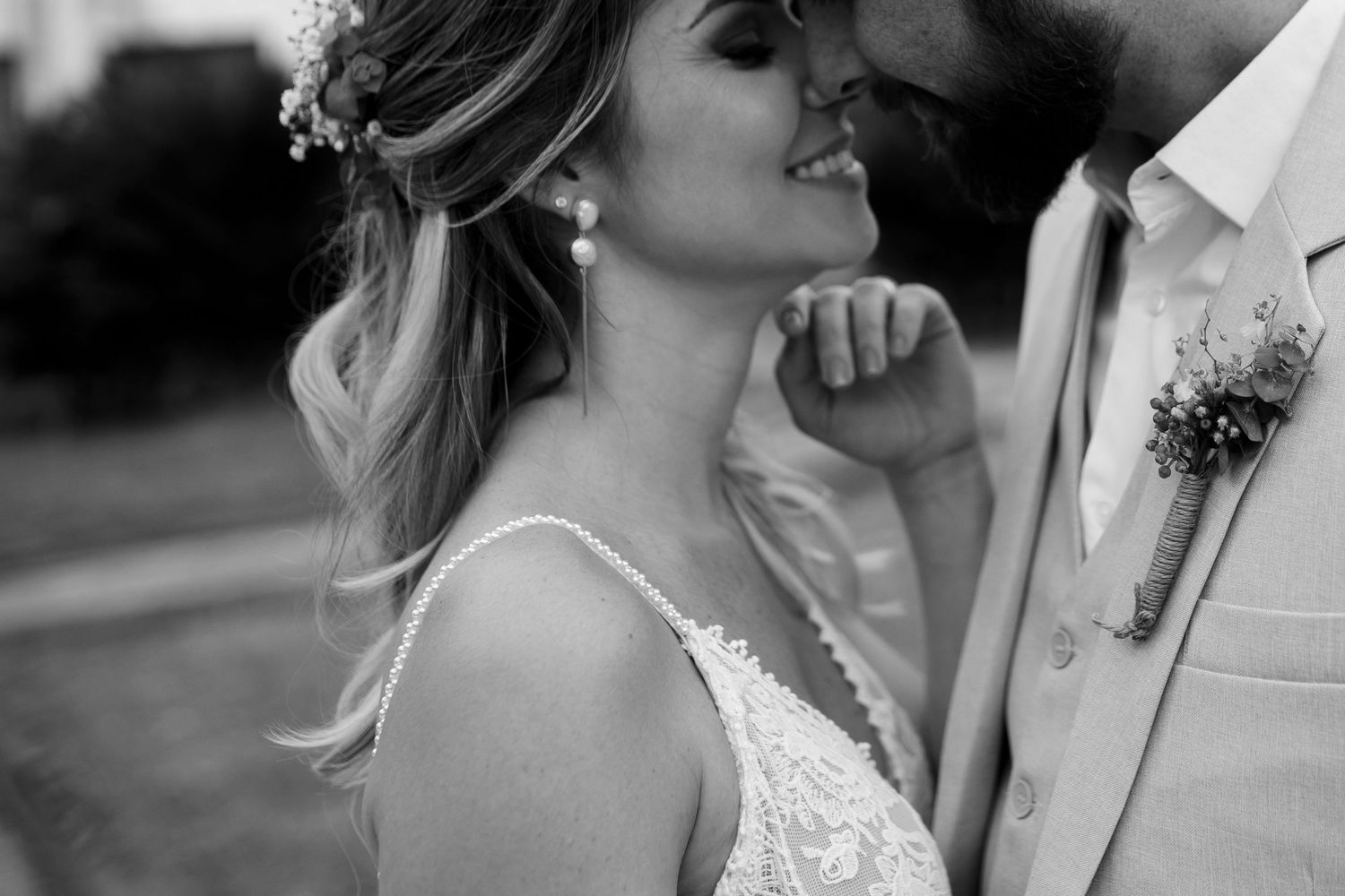 Intimate wedding portraits showing tender moments between newlyweds in black and white.